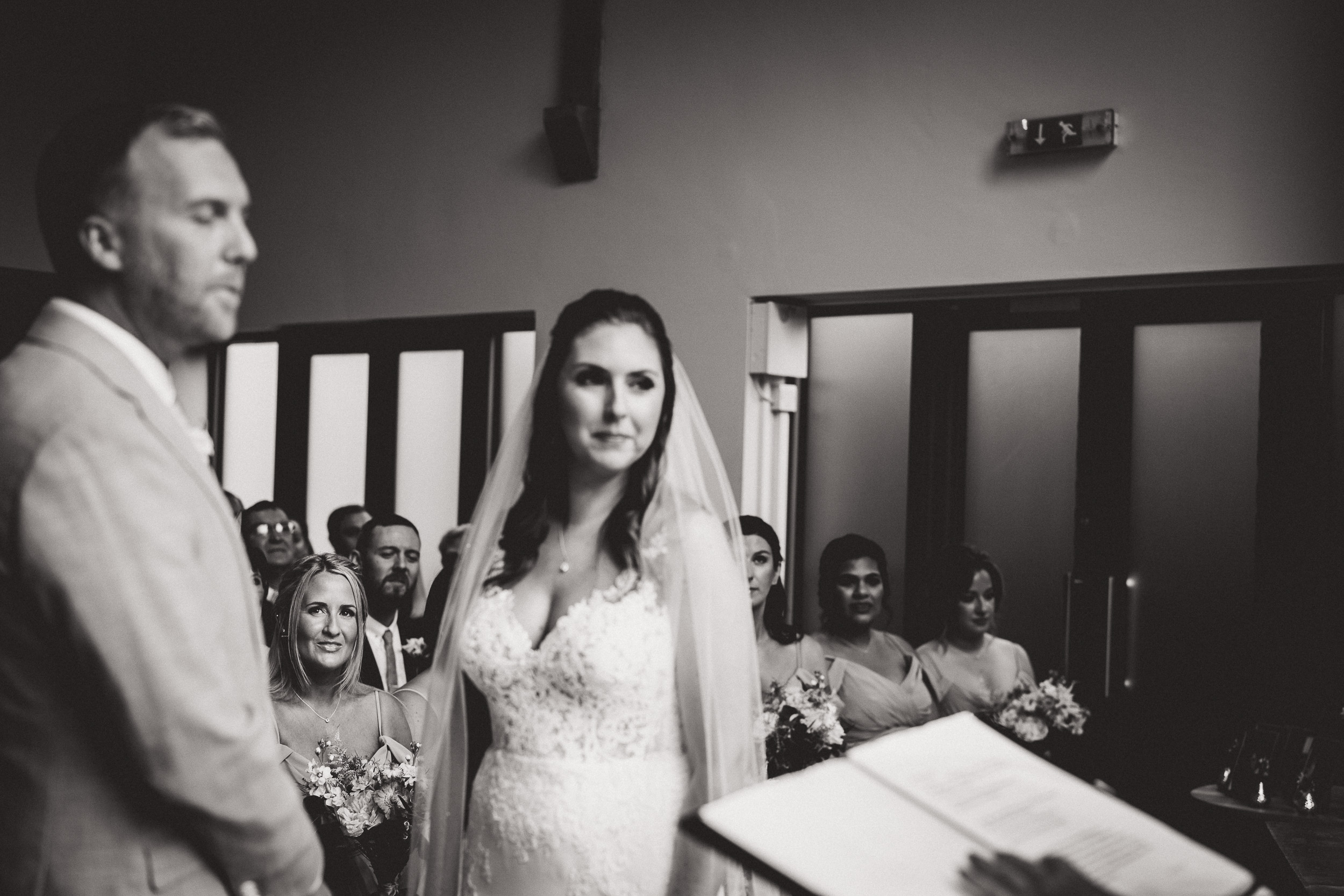 Wedding photographer capturing a heartfelt moment between bride and groom.