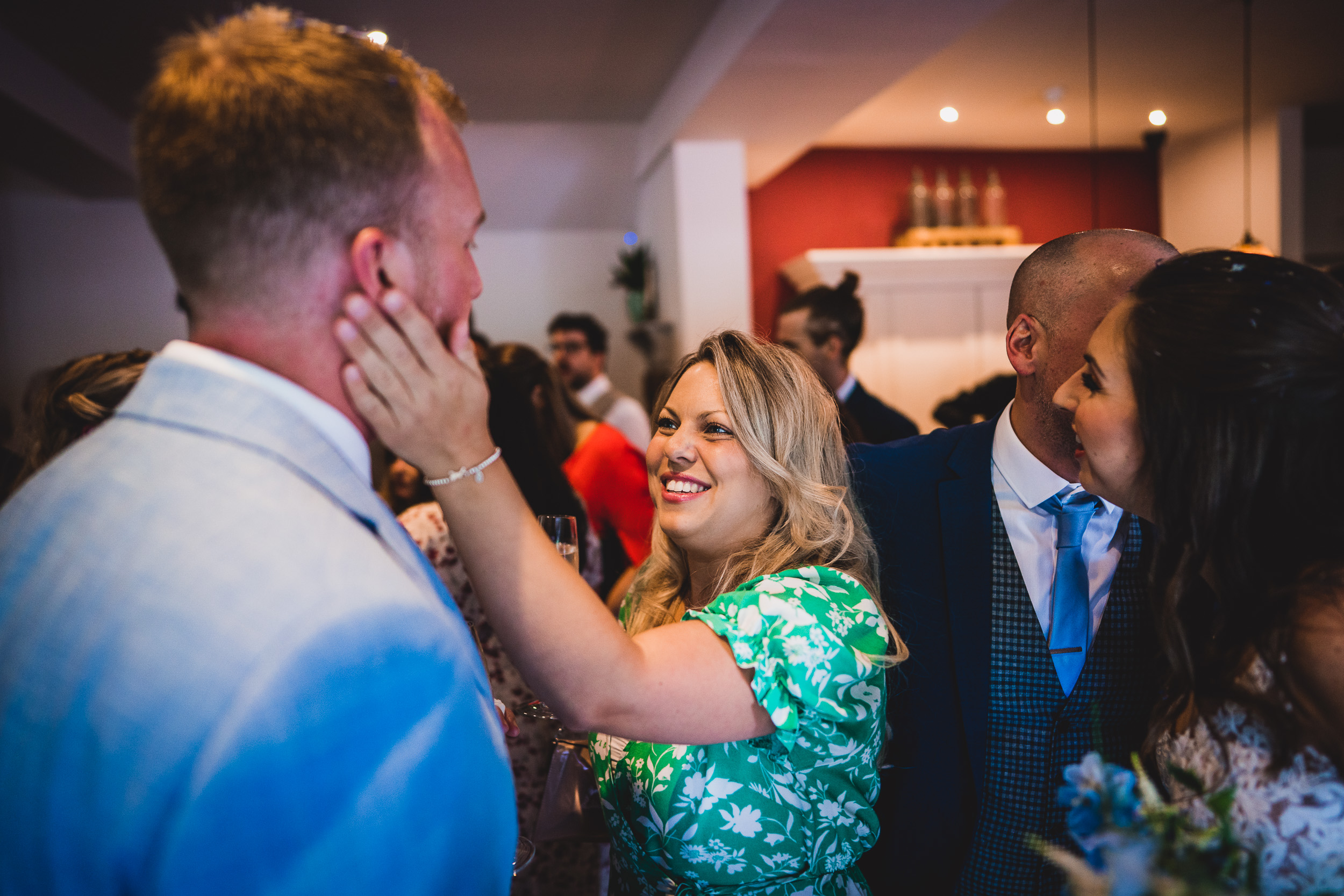 A groom embracing his bride captured by a wedding photographer.