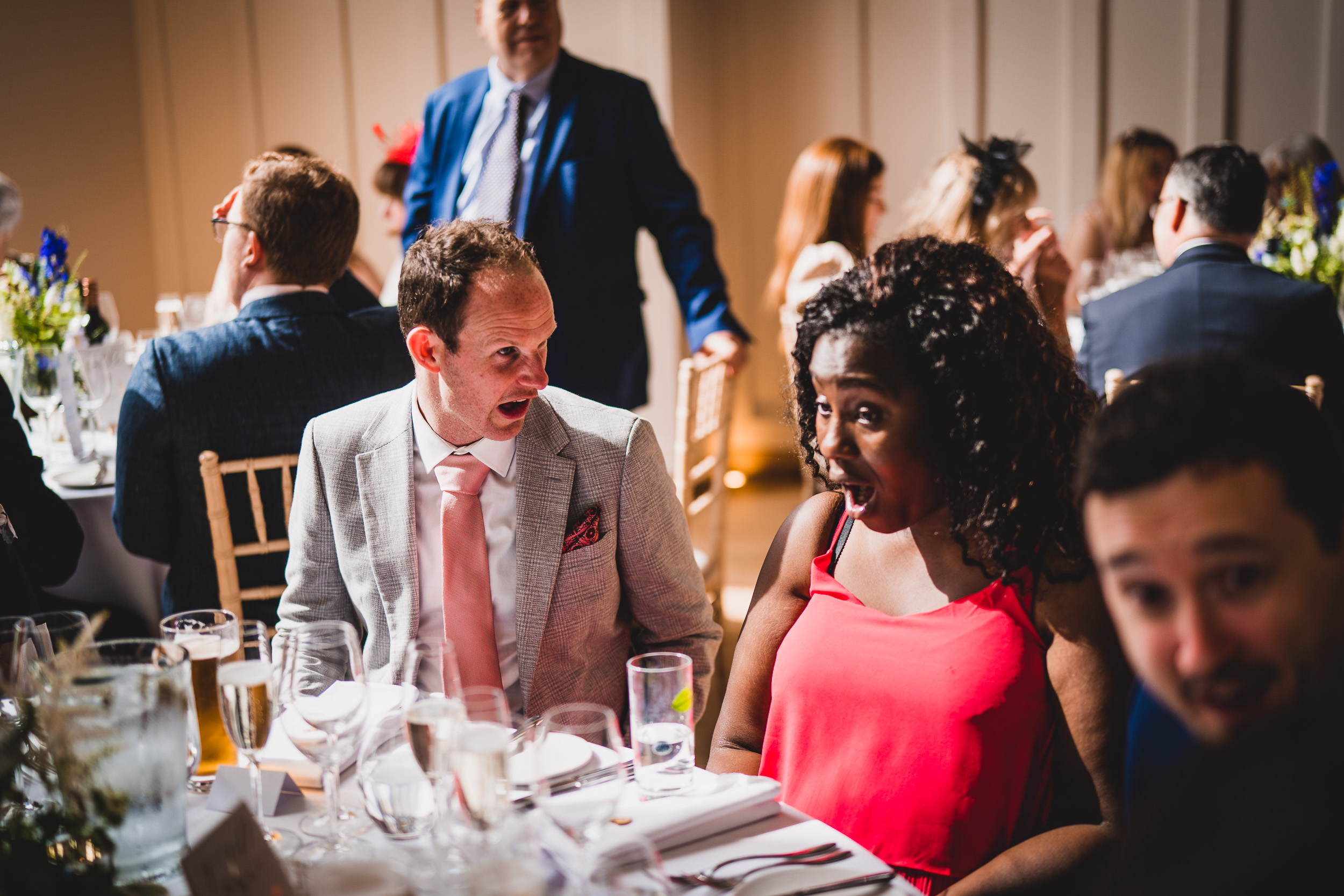 A groom and bride captured in a wedding photo at their reception.