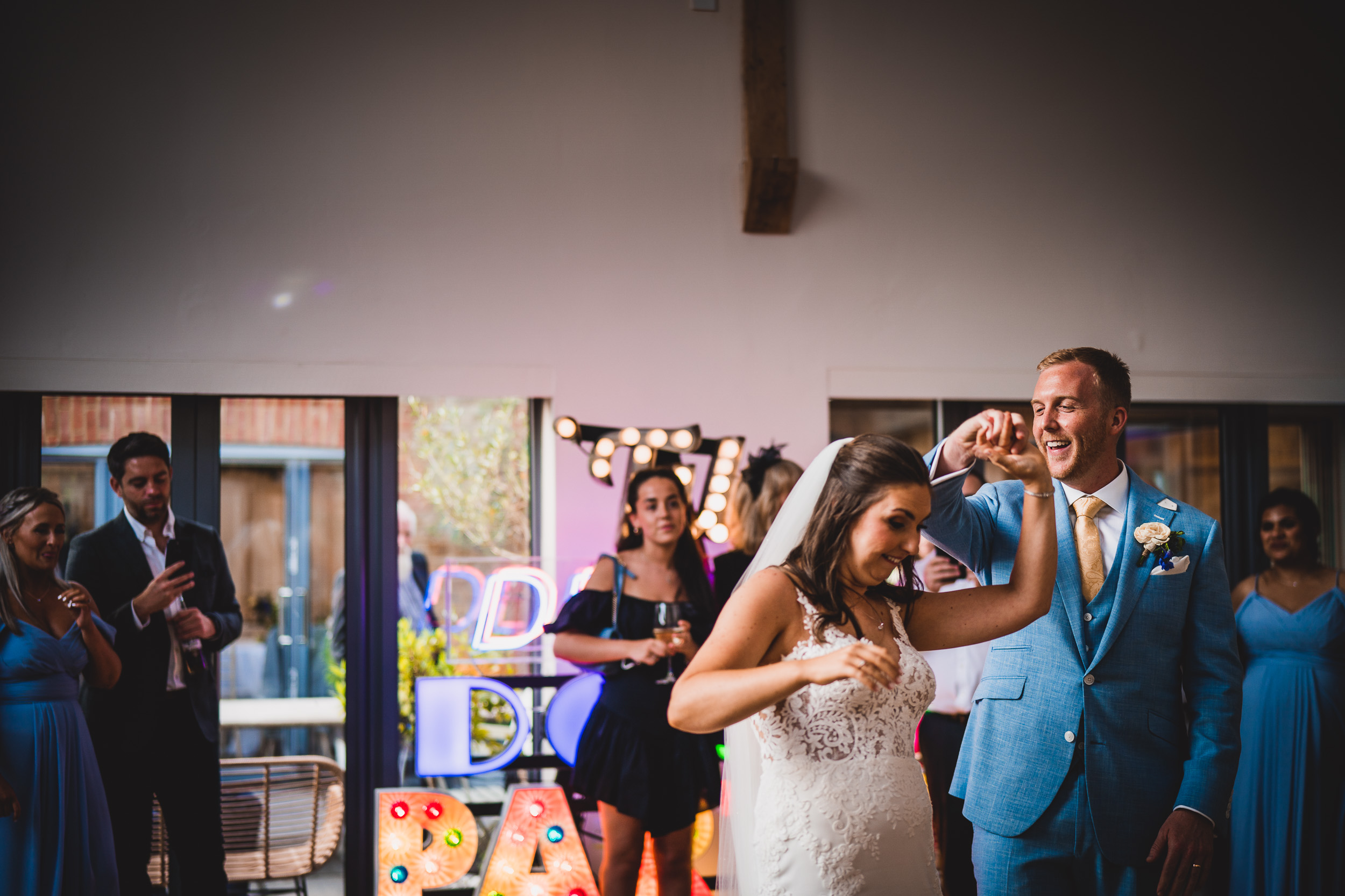 A groom dancing at his wedding reception.