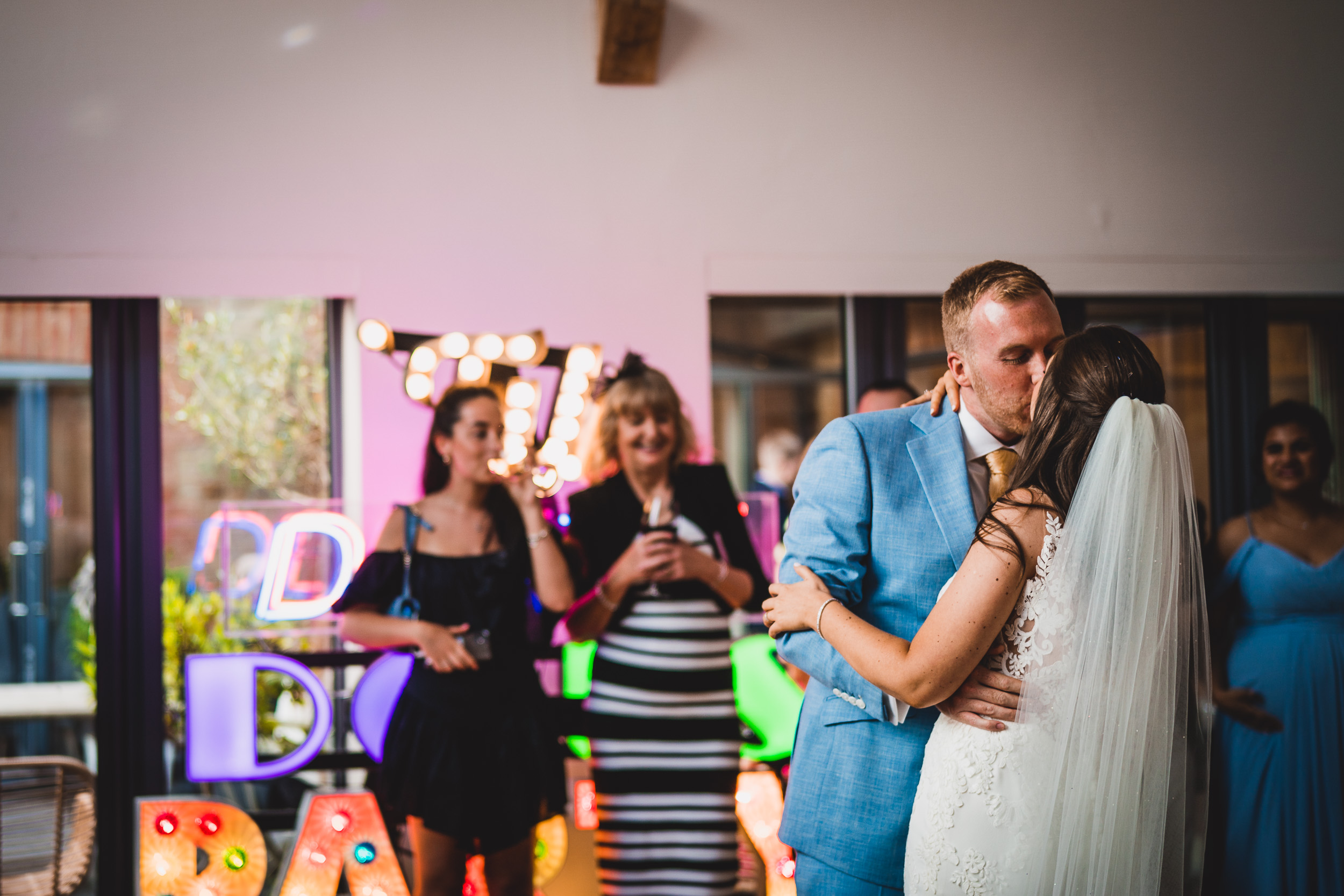 A groom and bride dancing at their wedding reception.