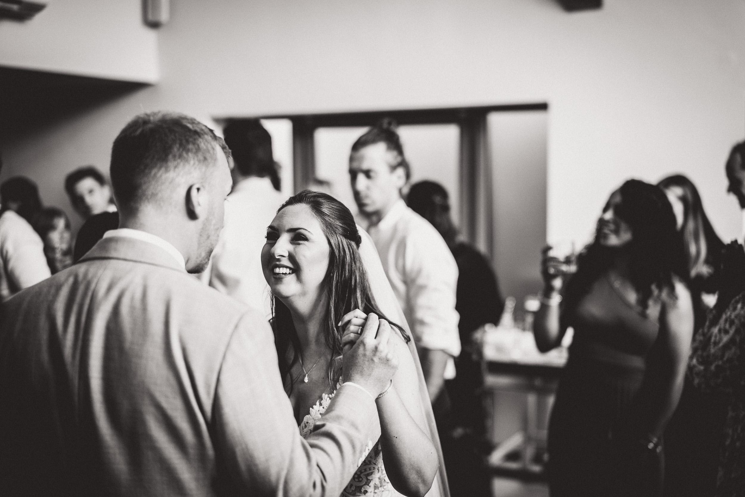 A bride and groom gracefully dancing captured by a wedding photographer.