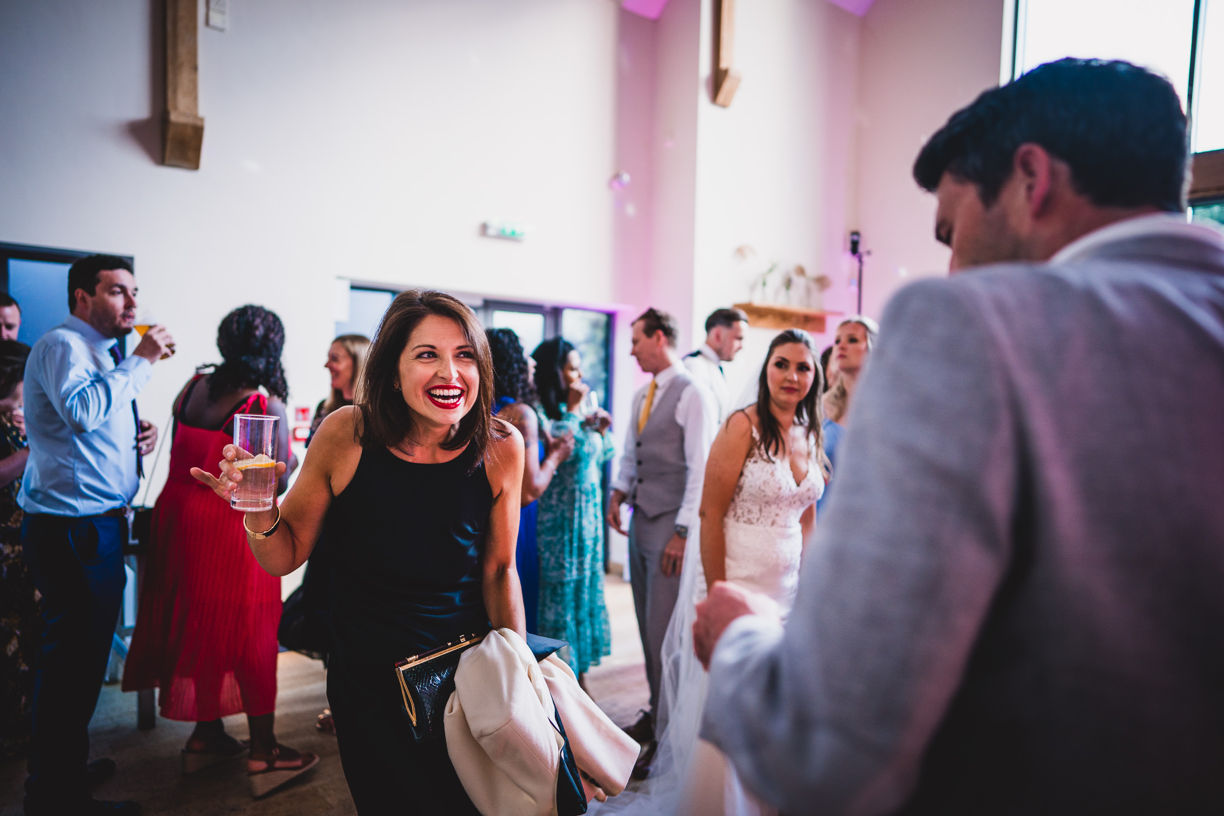 A wedding photo capturing the joyful bride and groom at their wedding reception.