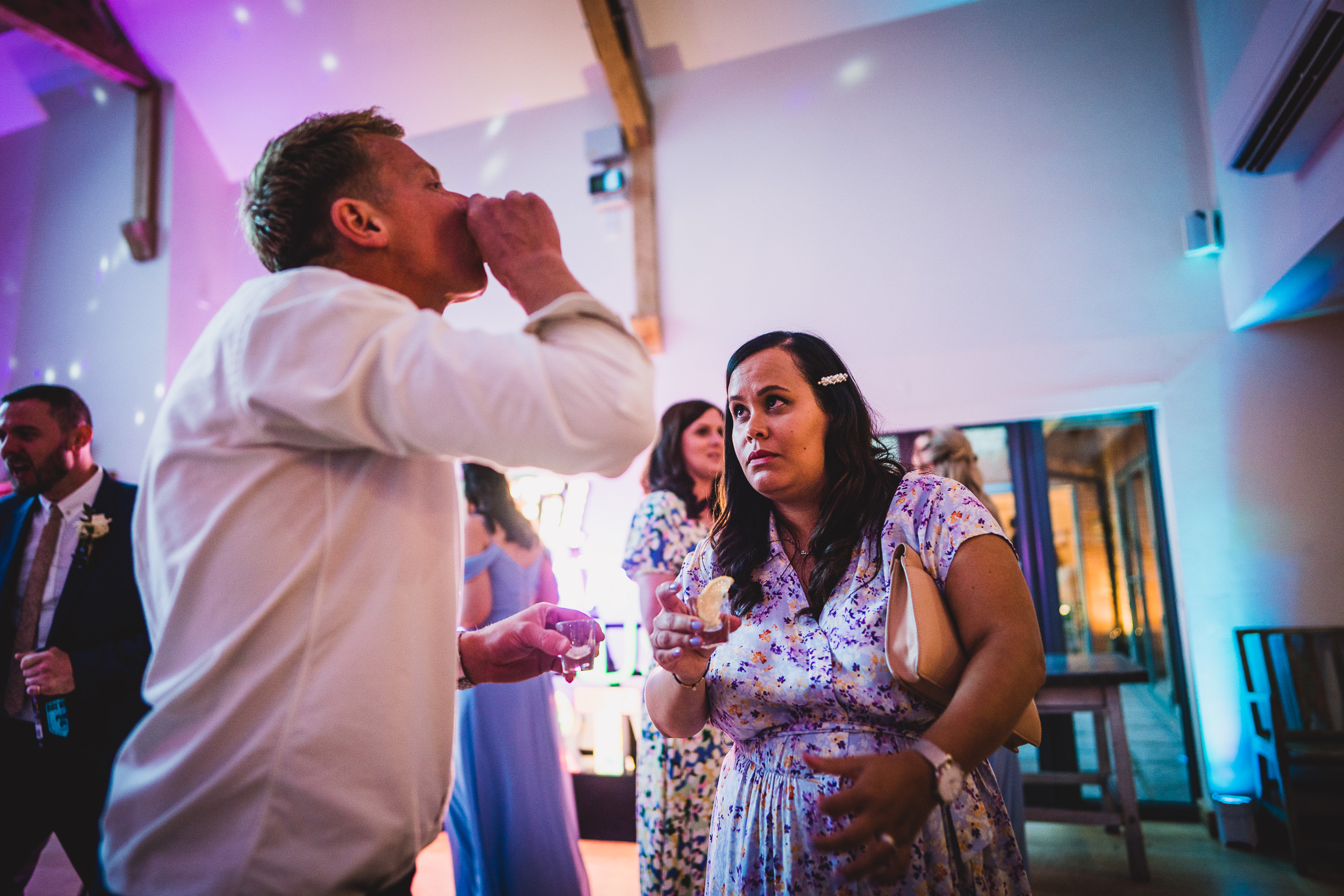 A groom and bride captured by a wedding photographer during a heartwarming wedding photo moment.