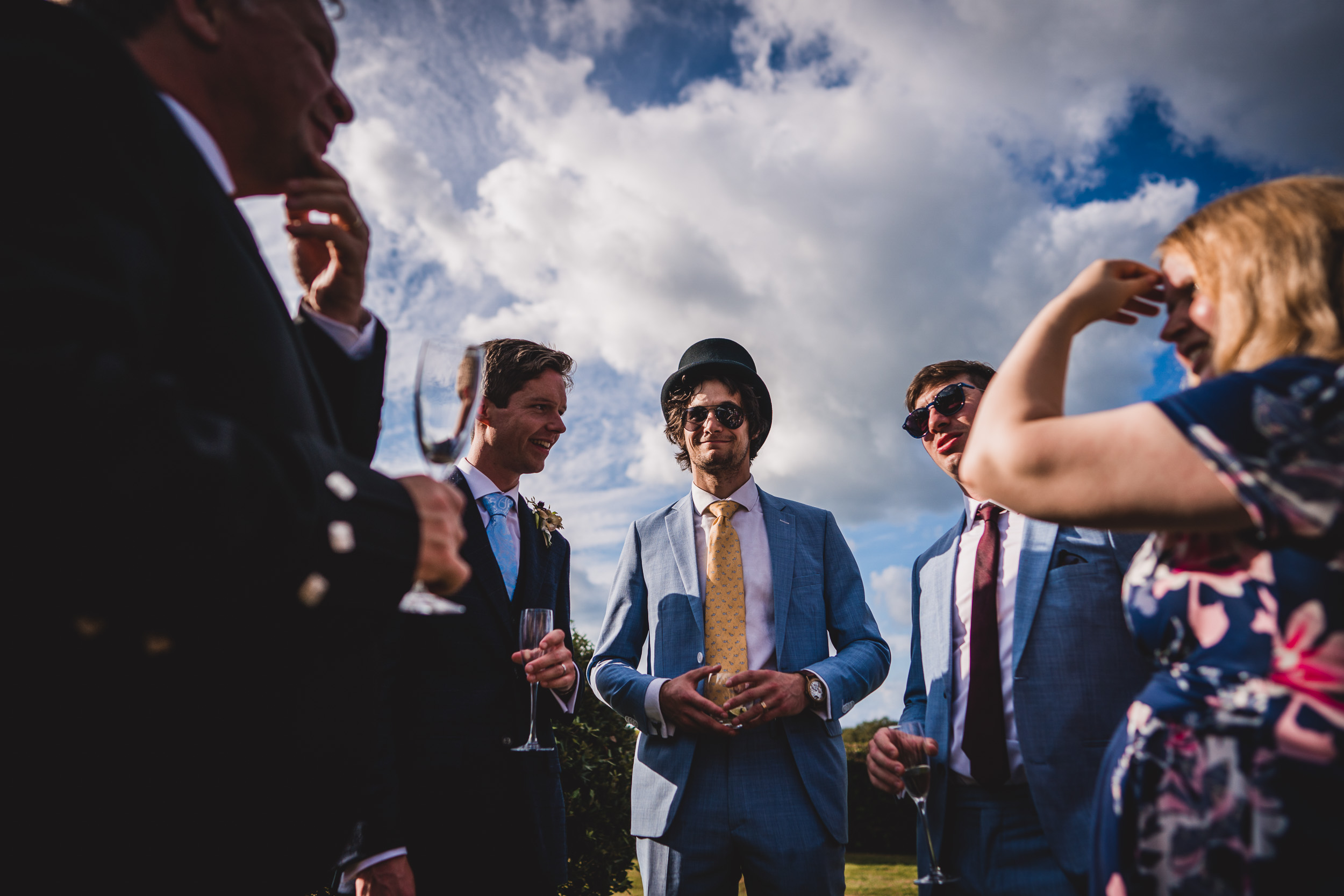 Groom and groomsmen posing for wedding photos.