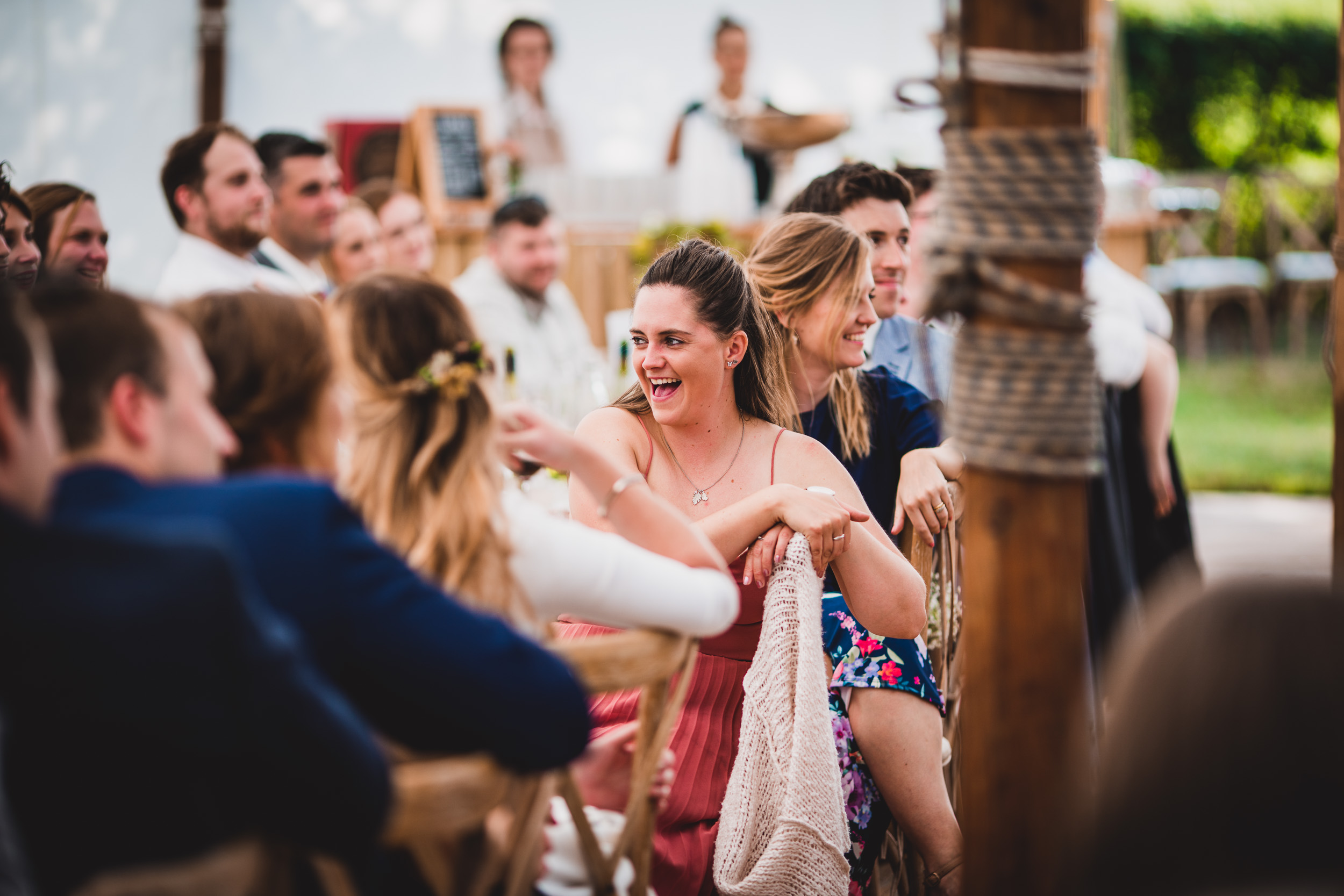 A laughing bride and groom on their wedding day.