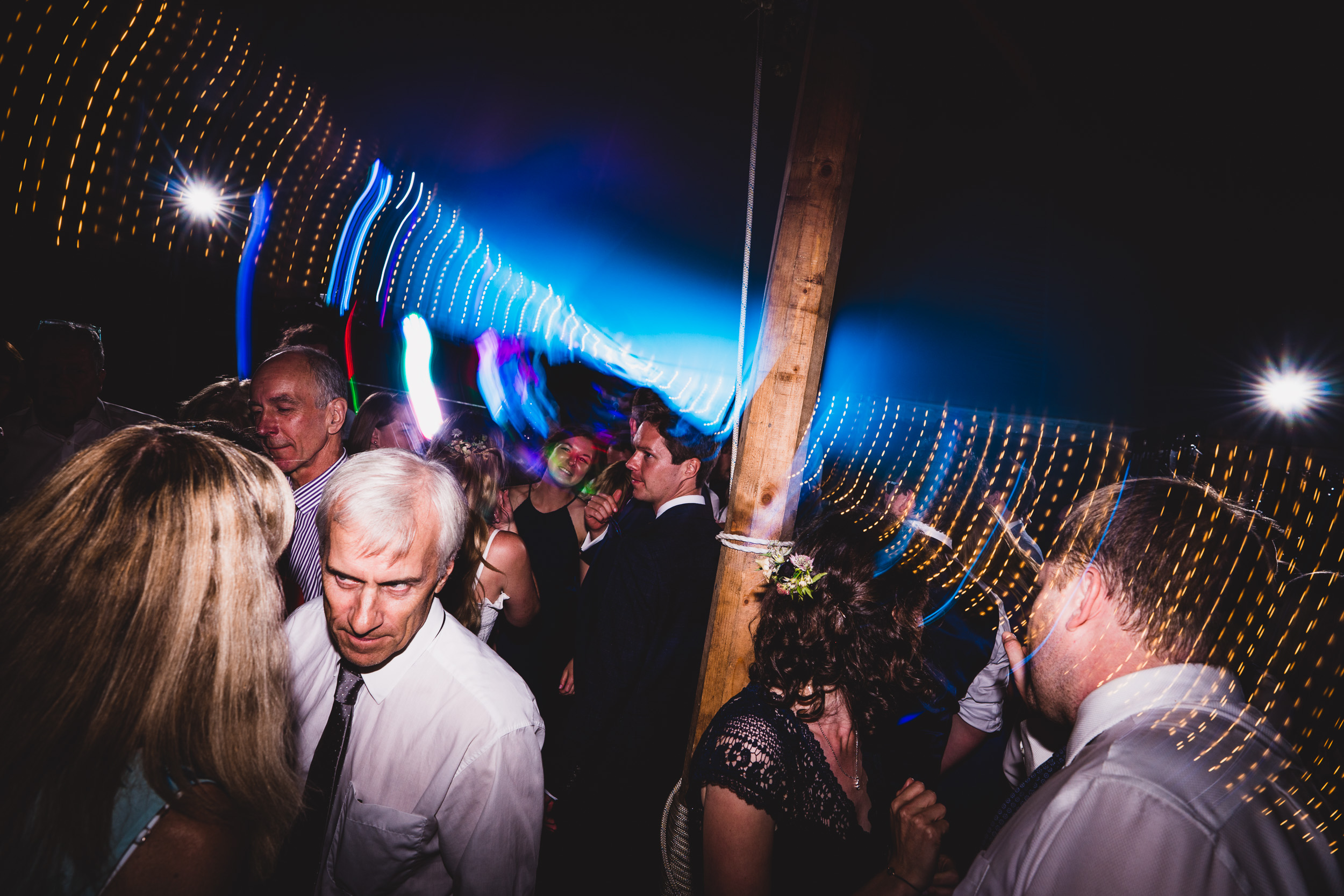 A wedding photo capturing the bride and groom dancing at their party.