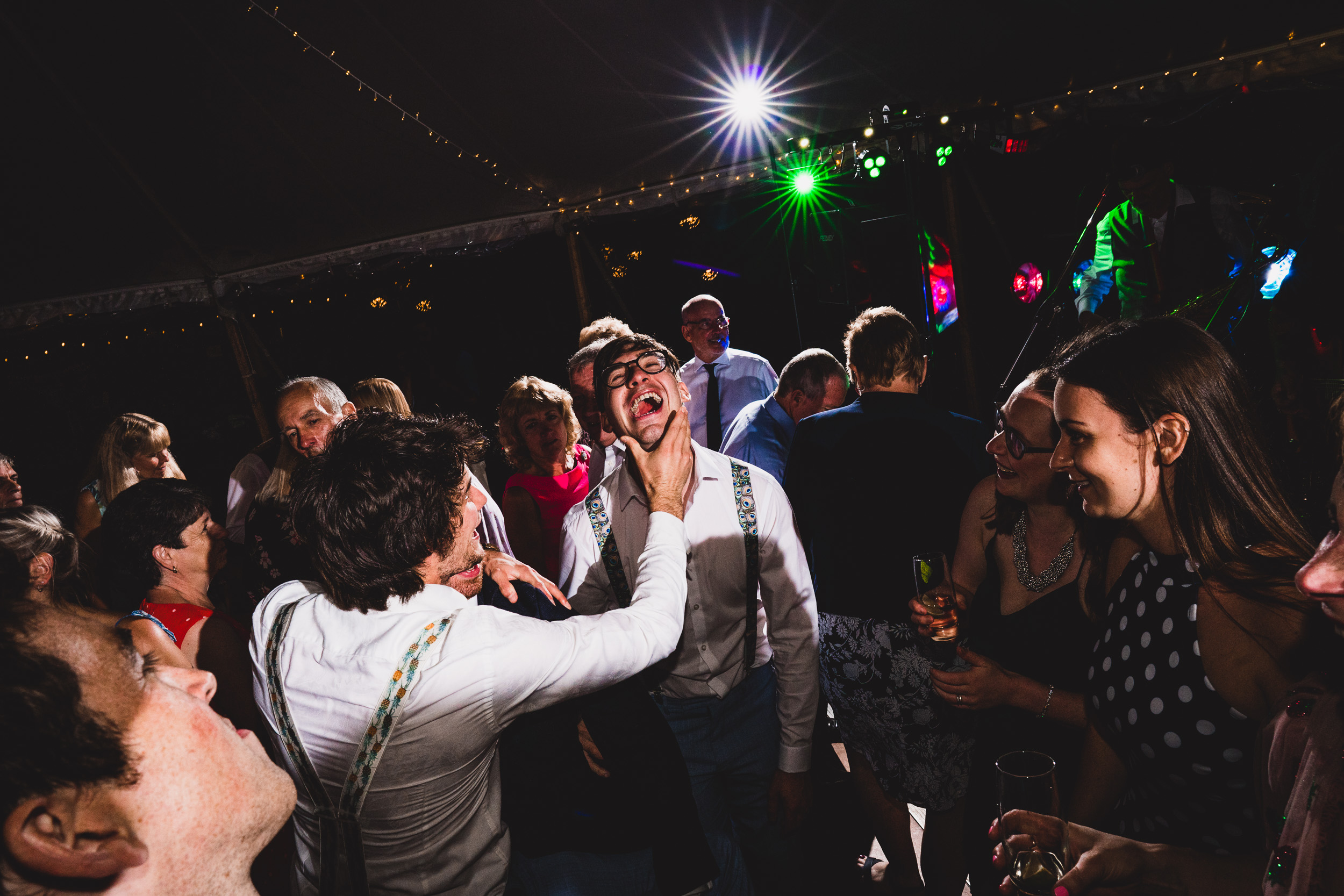 A group of people celebrating at a wedding party.