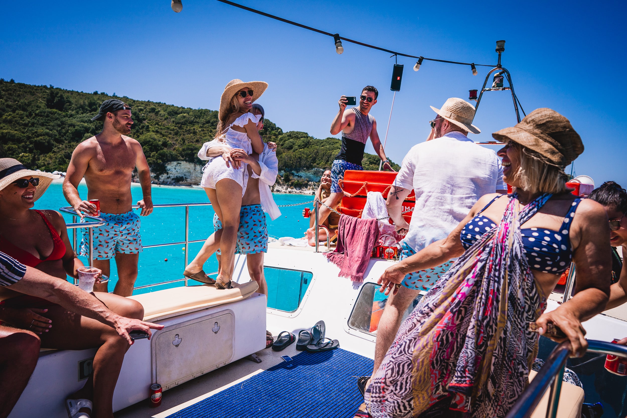 A wedding photo of the bride and groom onboard a boat.