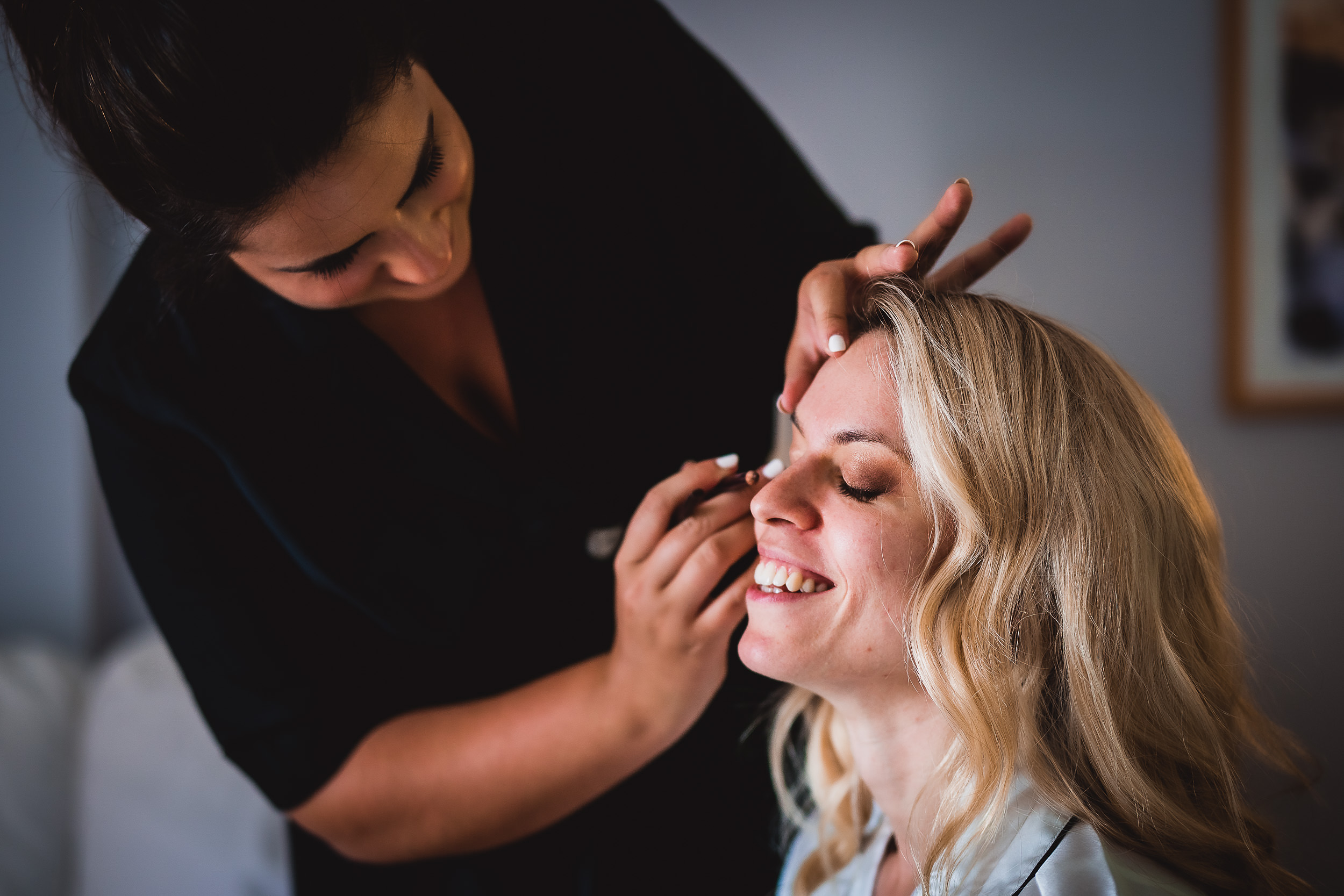 A bride getting her hair done for her wedding.