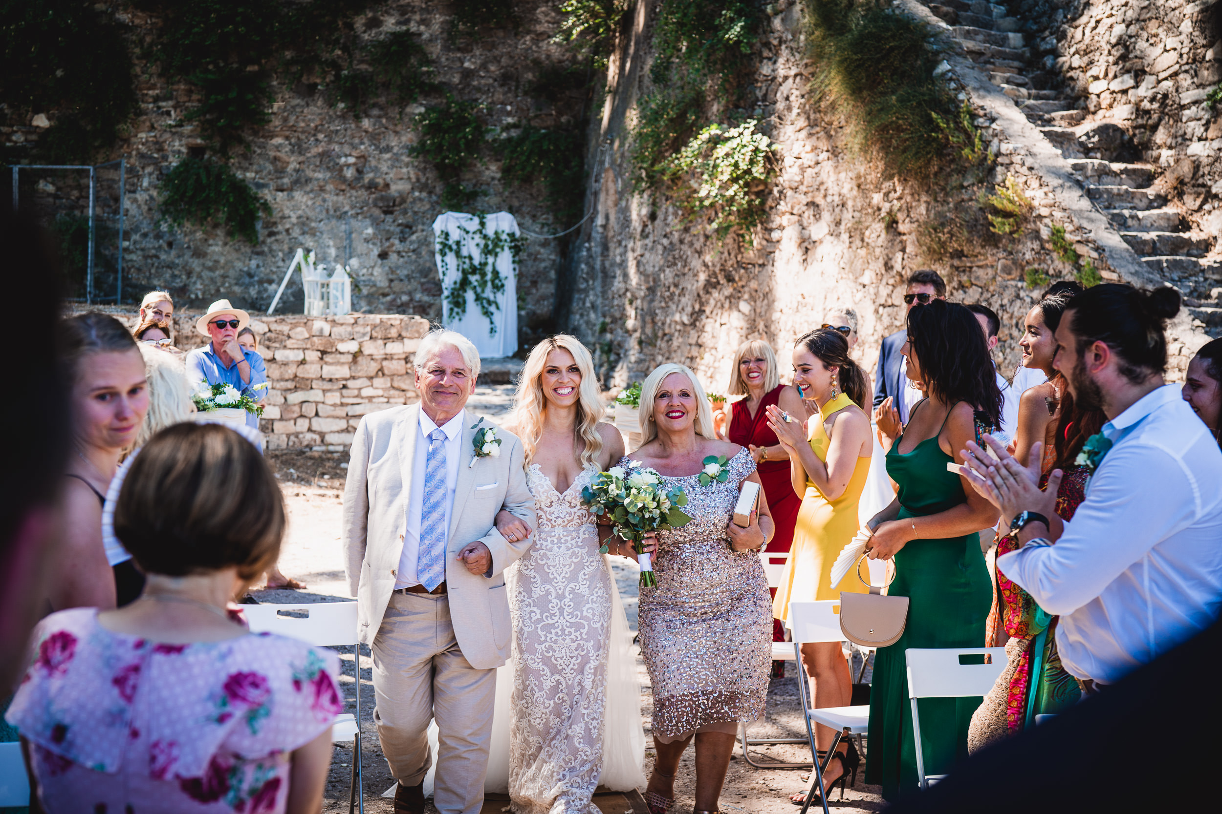 A bride and groom photographed at their wedding ceremony.