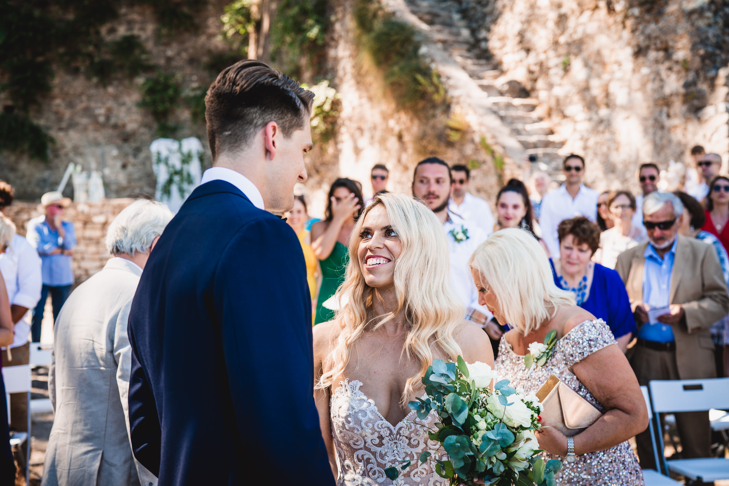 A groom and bride captured in a heartwarming wedding photo.