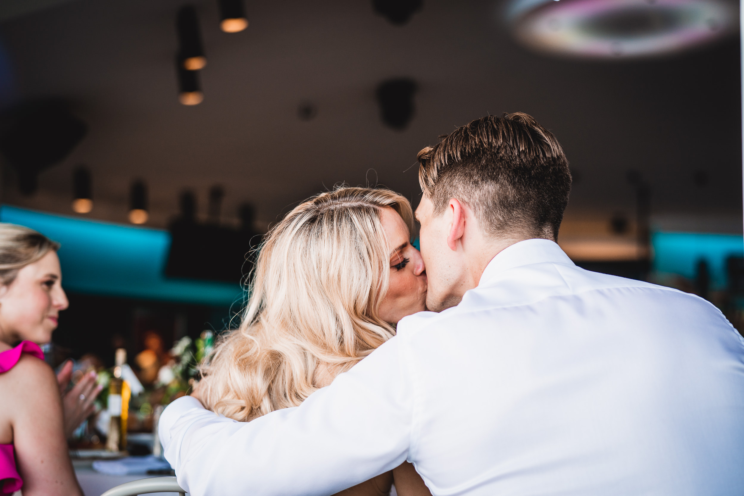 A bride and groom captured by a wedding photographer during their wedding reception.