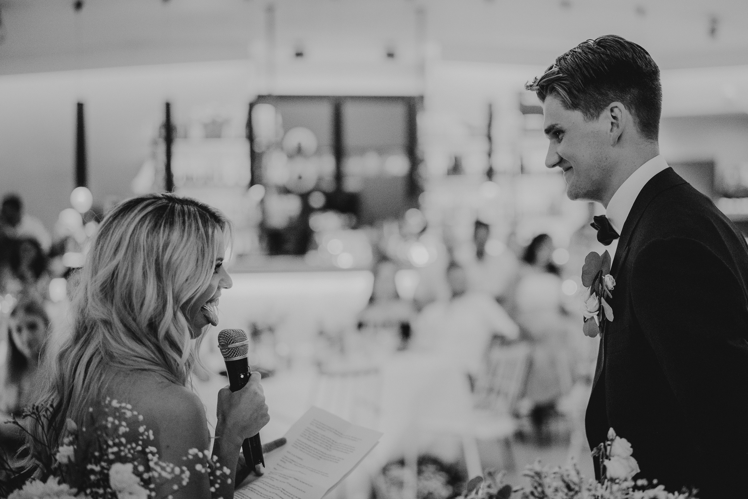 A bride and groom conversing during their wedding ceremony.