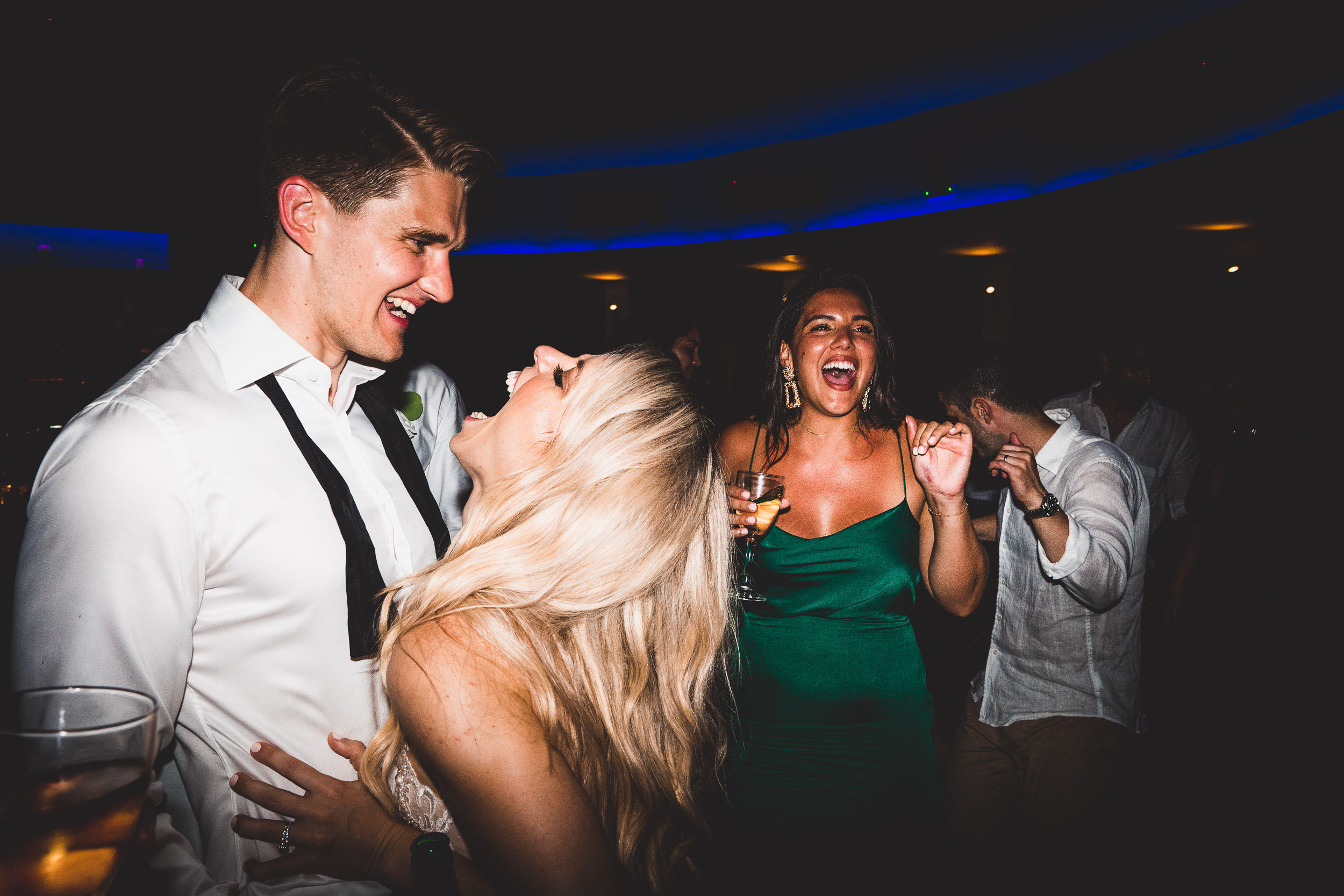 A groom dancing with the bride captured by the wedding photographer for a memorable wedding photo.