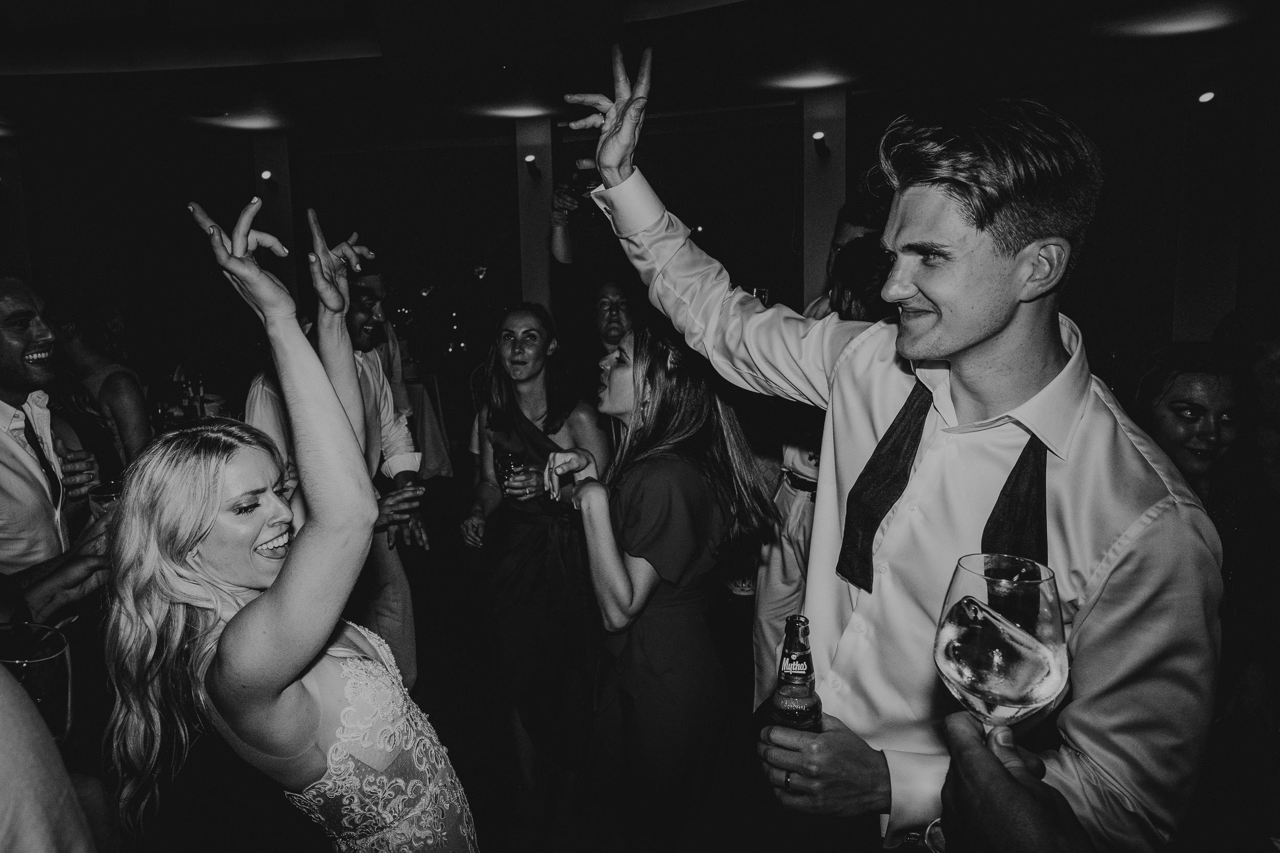 Black and white photo of a wedding couple dancing on the dance floor.