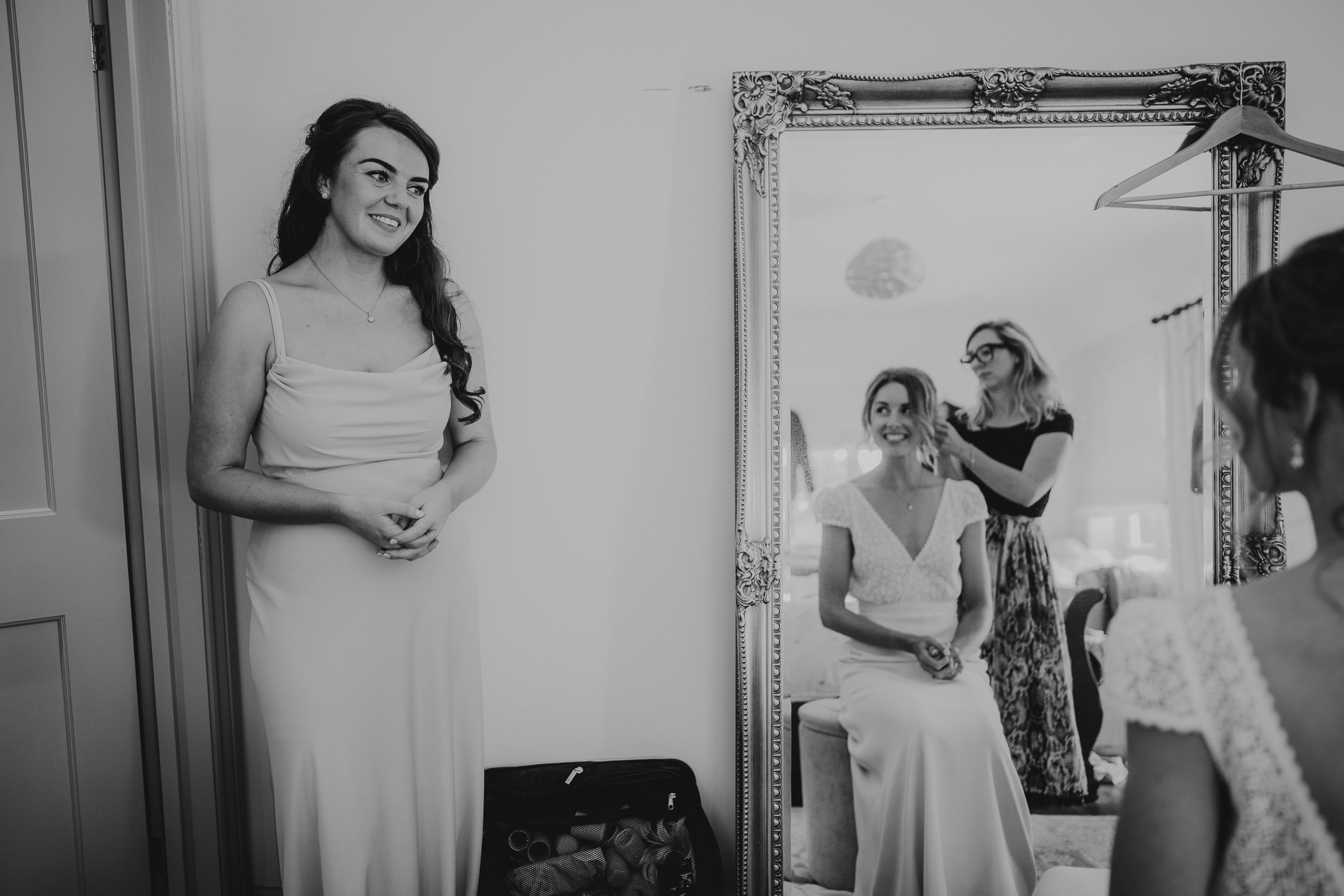 A bride preparing for her wedding, captured by a wedding photographer.