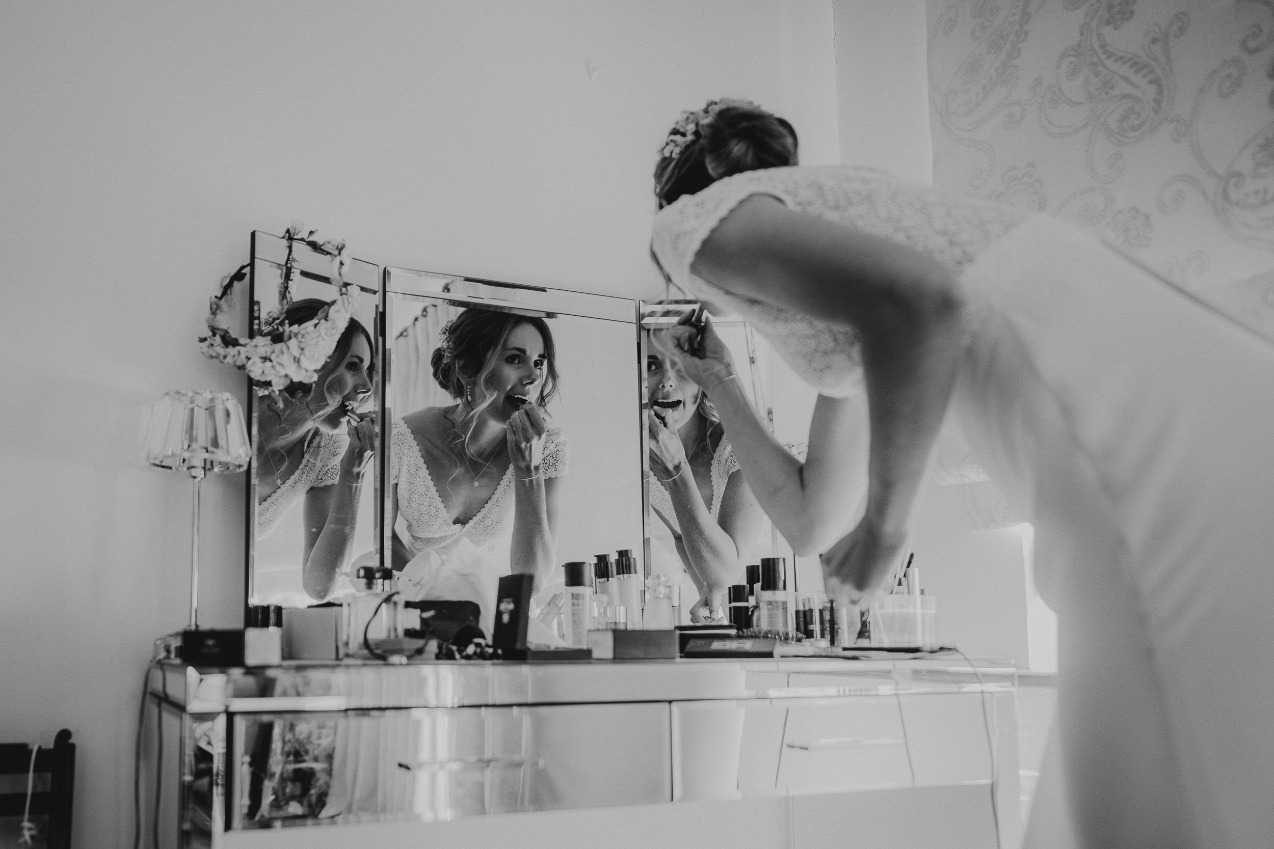 A bride preparing for her wedding, captured in a photo by the wedding photographer.
