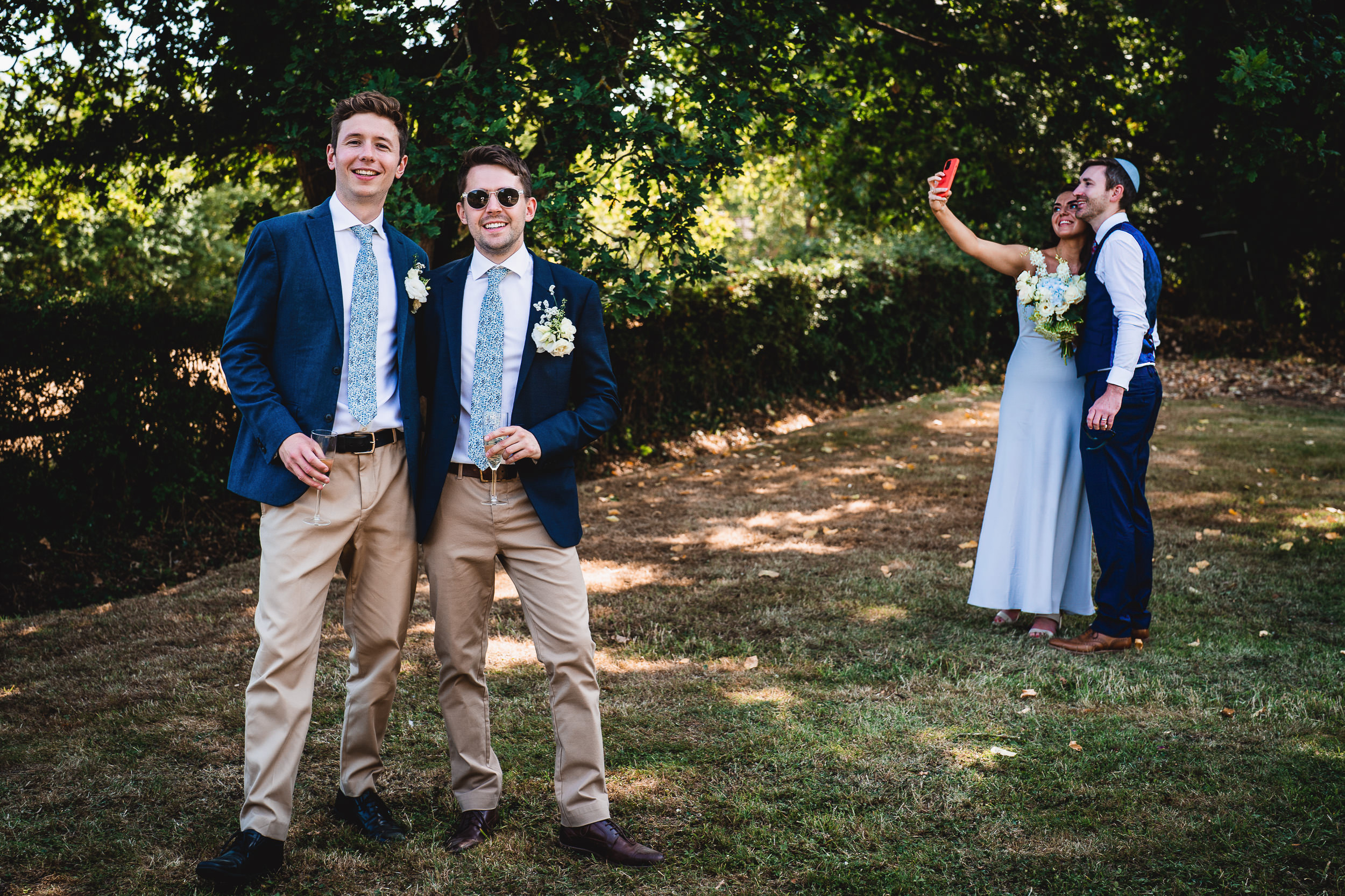 A group of men in suits attending a wedding ceremony.