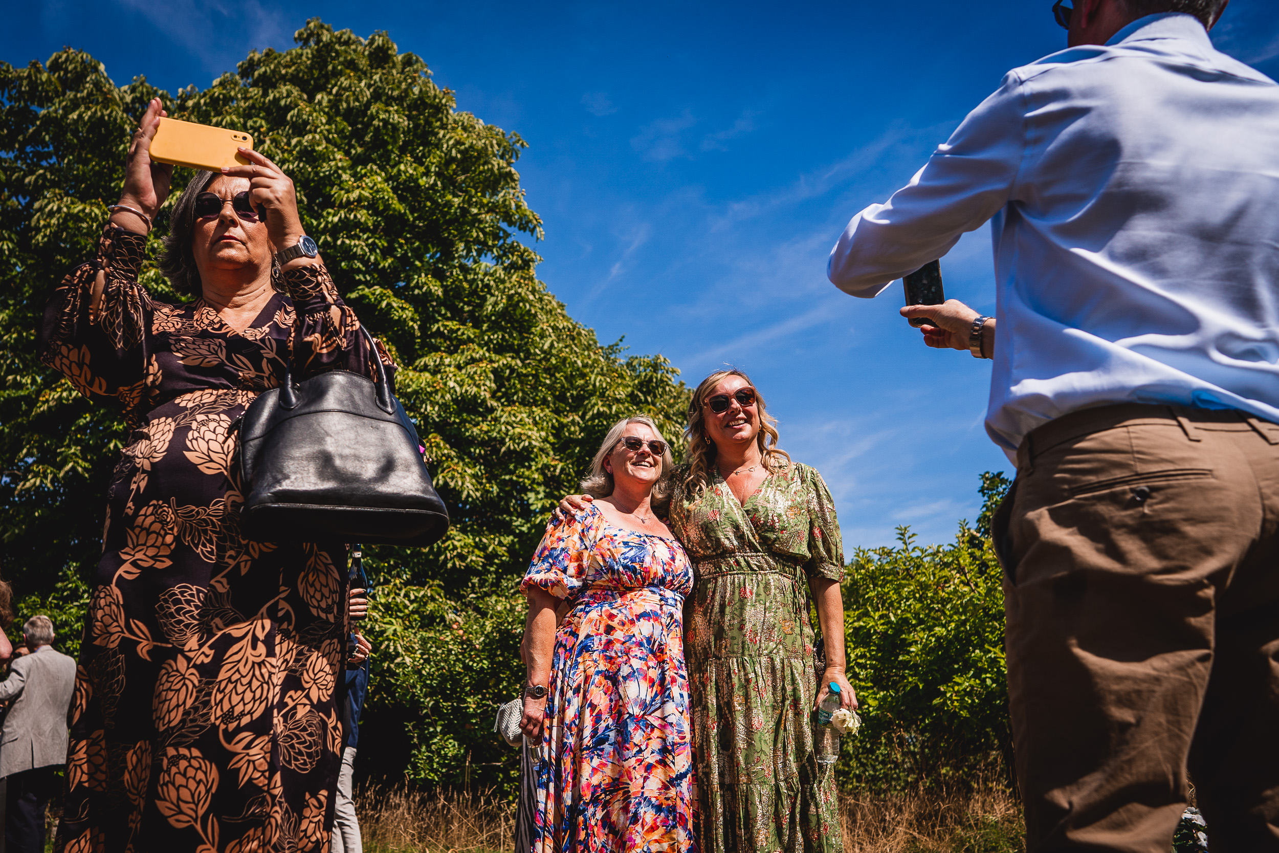 A bride is being captured by a wedding photographer.