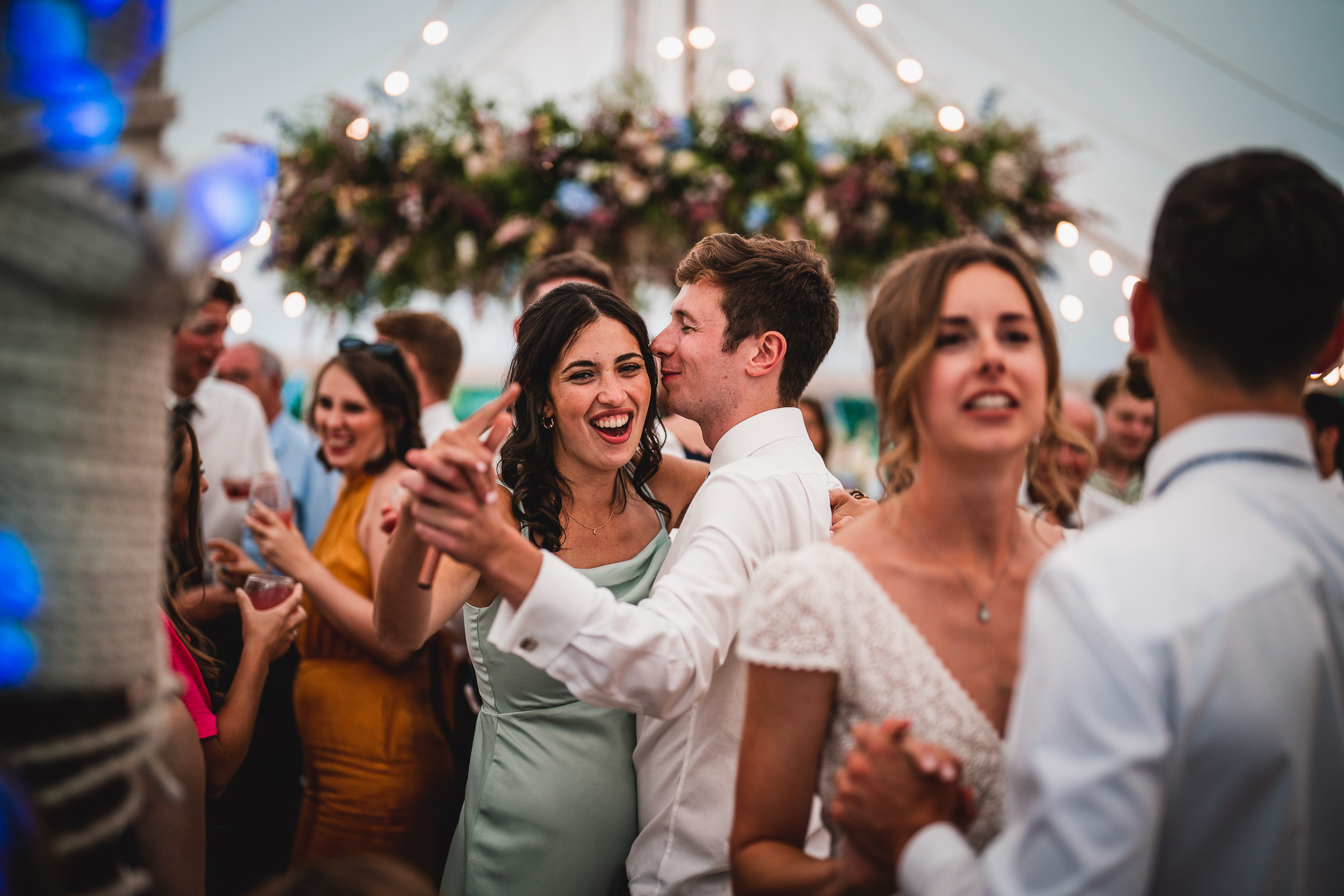A bride and groom dancing at their wedding reception, captured by a wedding photographer.