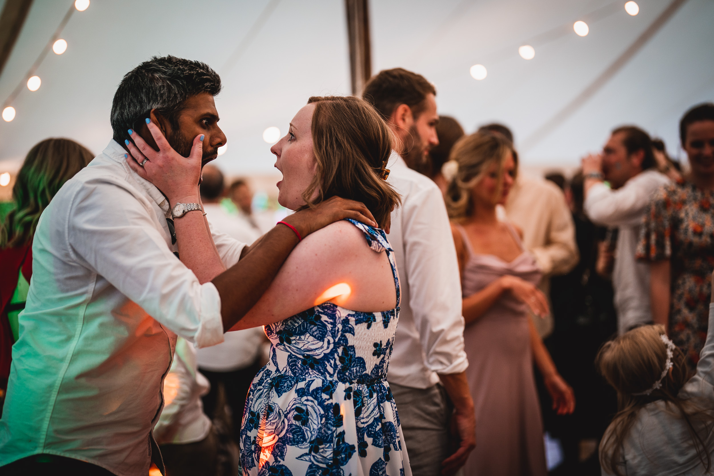 Holly and Max embrace on the dance floor at their Surrey Hills marquee wedding.