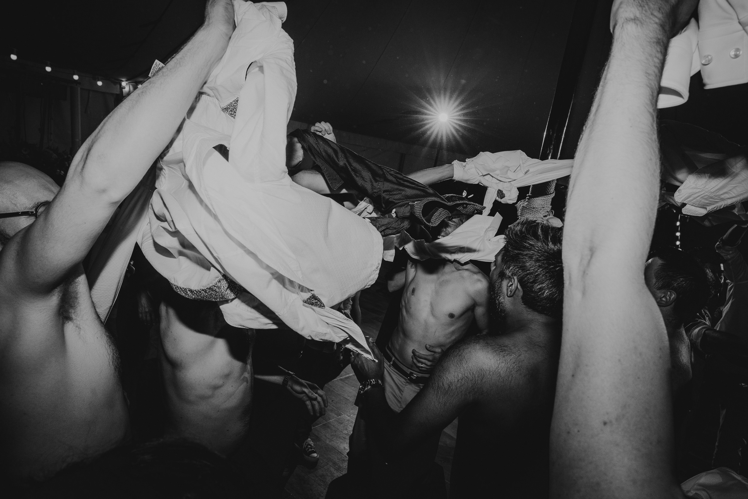 A black and white photo of a wedding party.