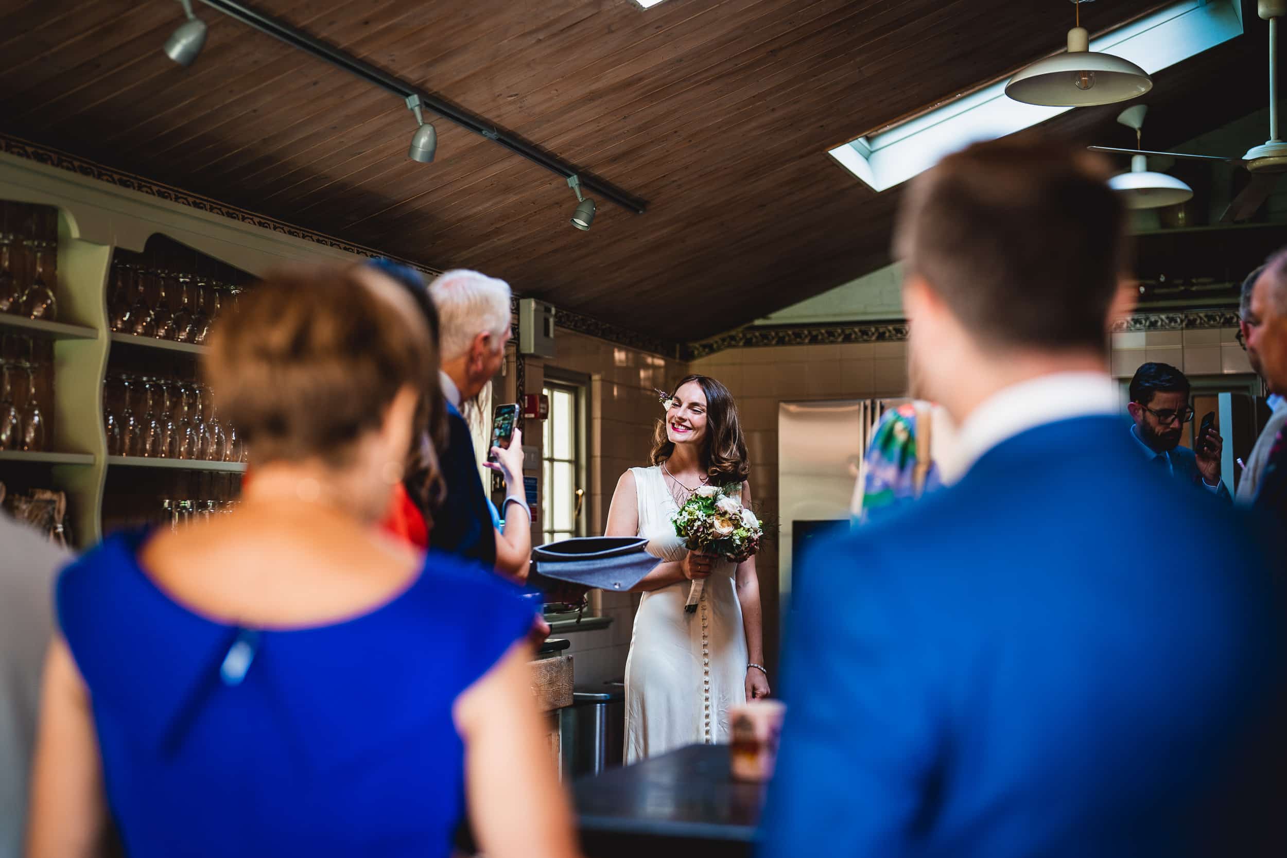 A bride walks down the aisle at a Surrey wedding.