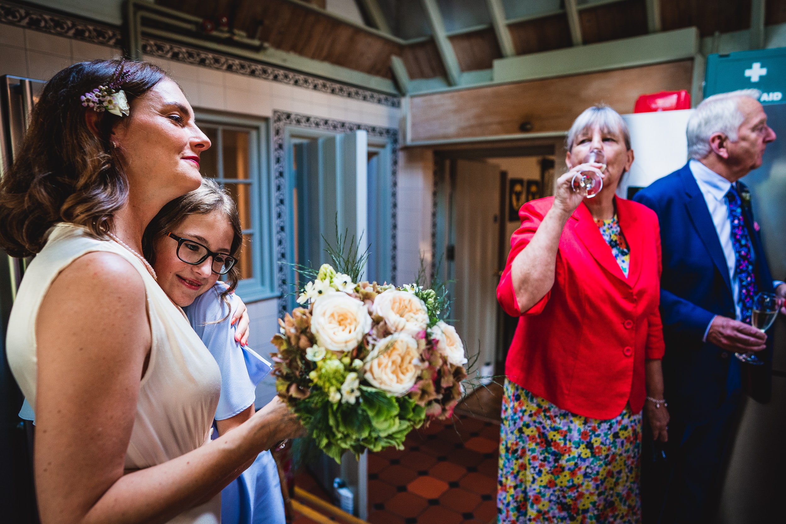 A Surrey Wedding couple with flowers in their hands at Ridge Farm.