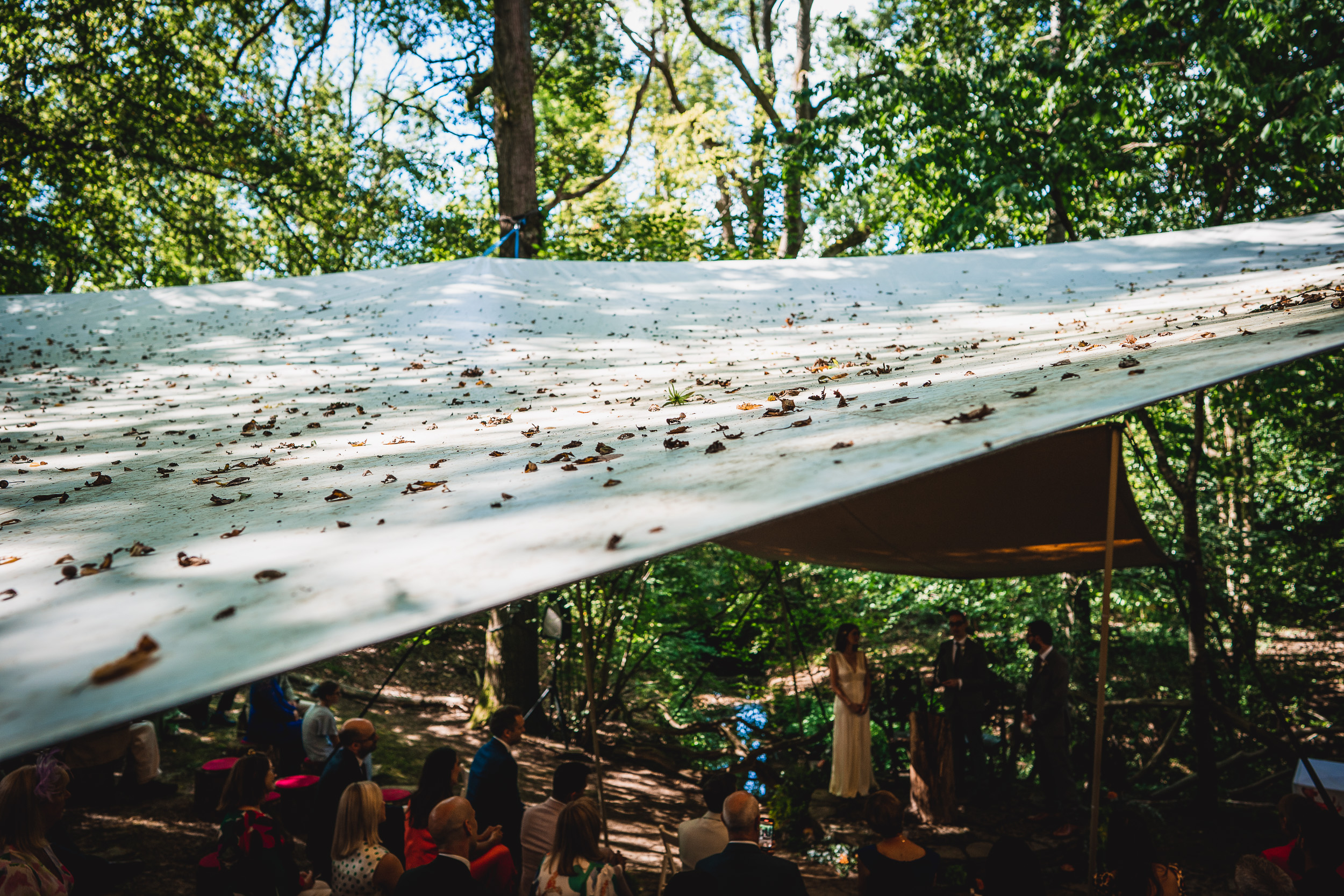 A Surrey Wedding ceremony in the woods under a tarp at Ridge Farm.