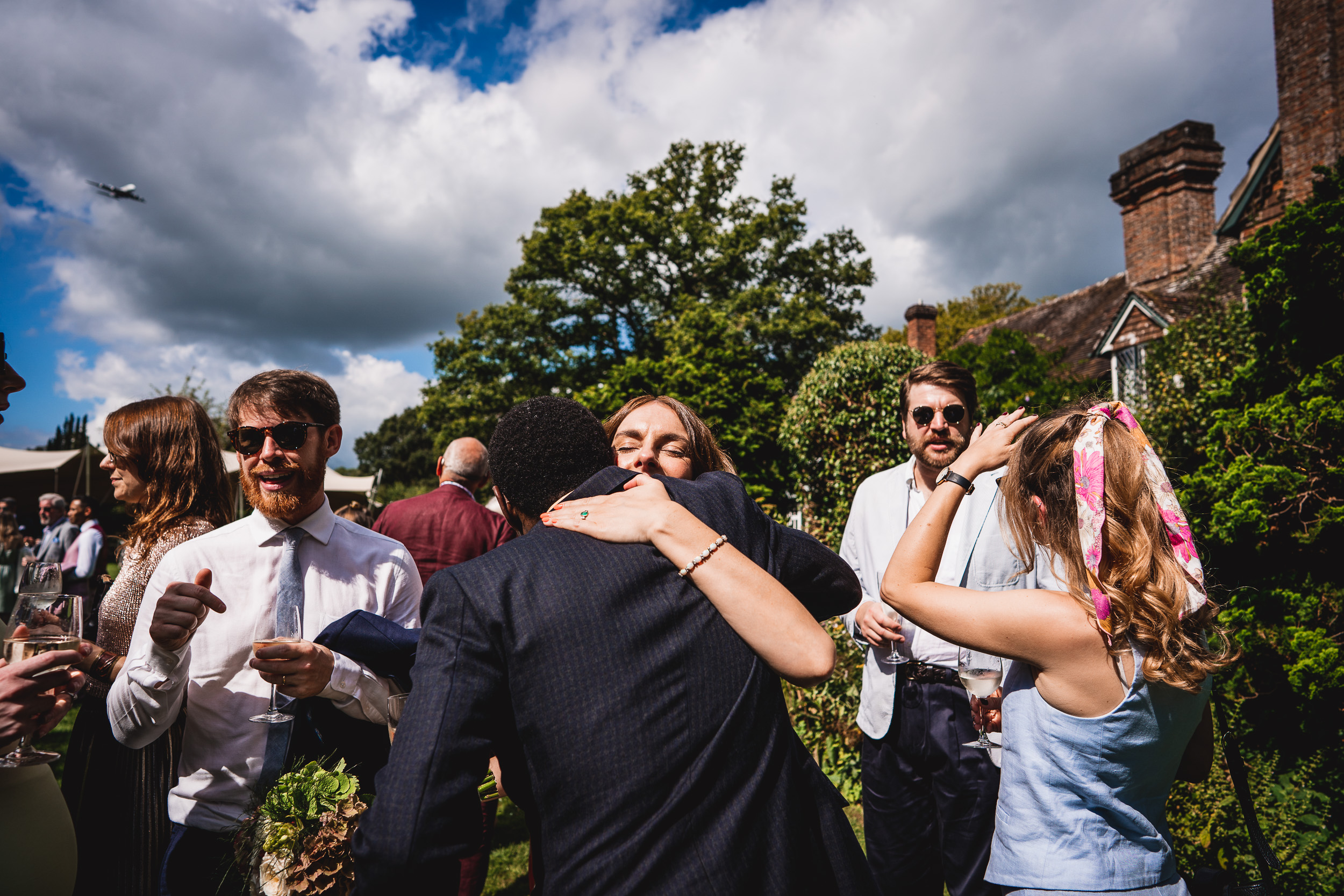 A man and woman sharing an affectionate embrace at a Surrey wedding in Ridge Farm.