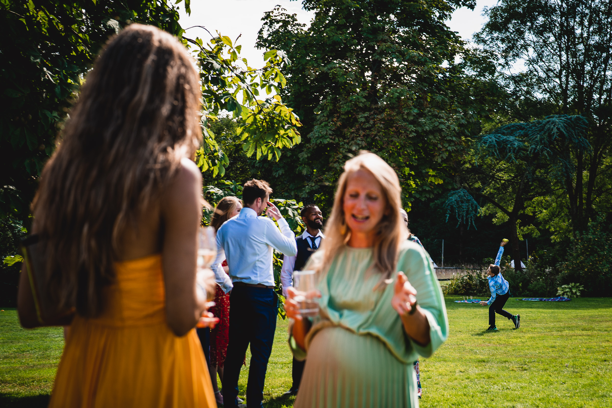 A group of people at Ridge Farm in Surrey, talking to each other.