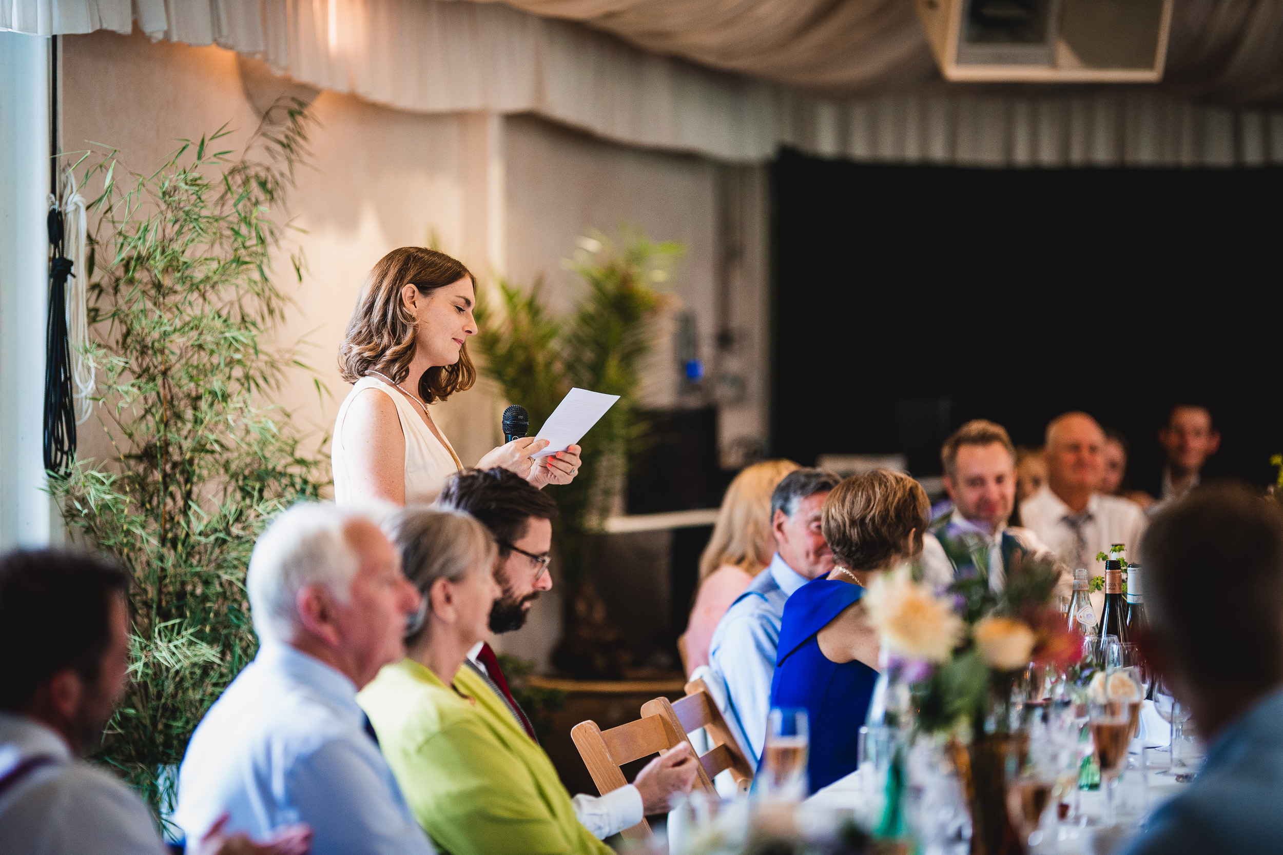 A woman giving a speech at a Surrey wedding reception in Ridge Farm.