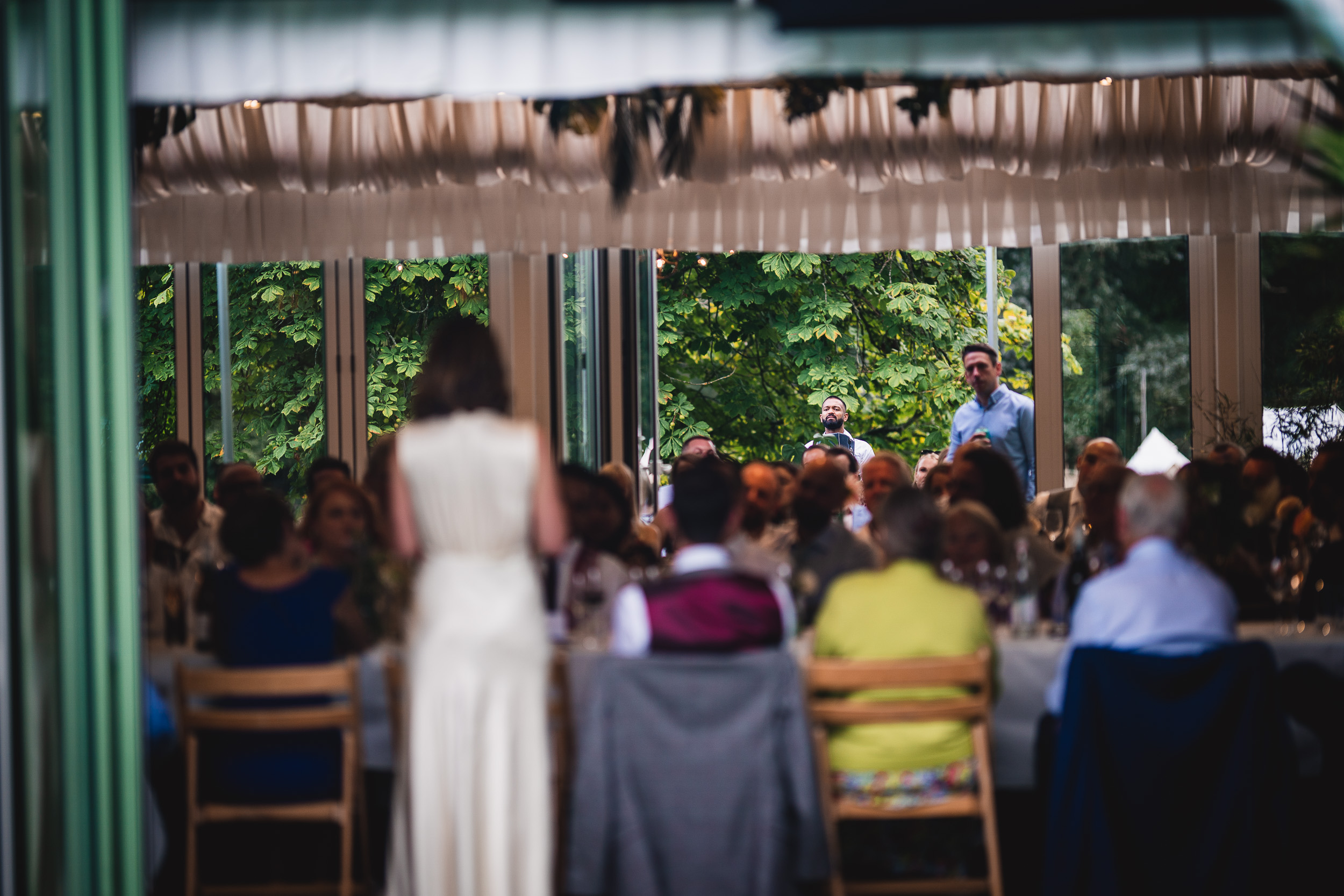 A beautiful Surrey wedding reception in the scenic gardens of Ridge Farm, showcasing a happy bride and groom.