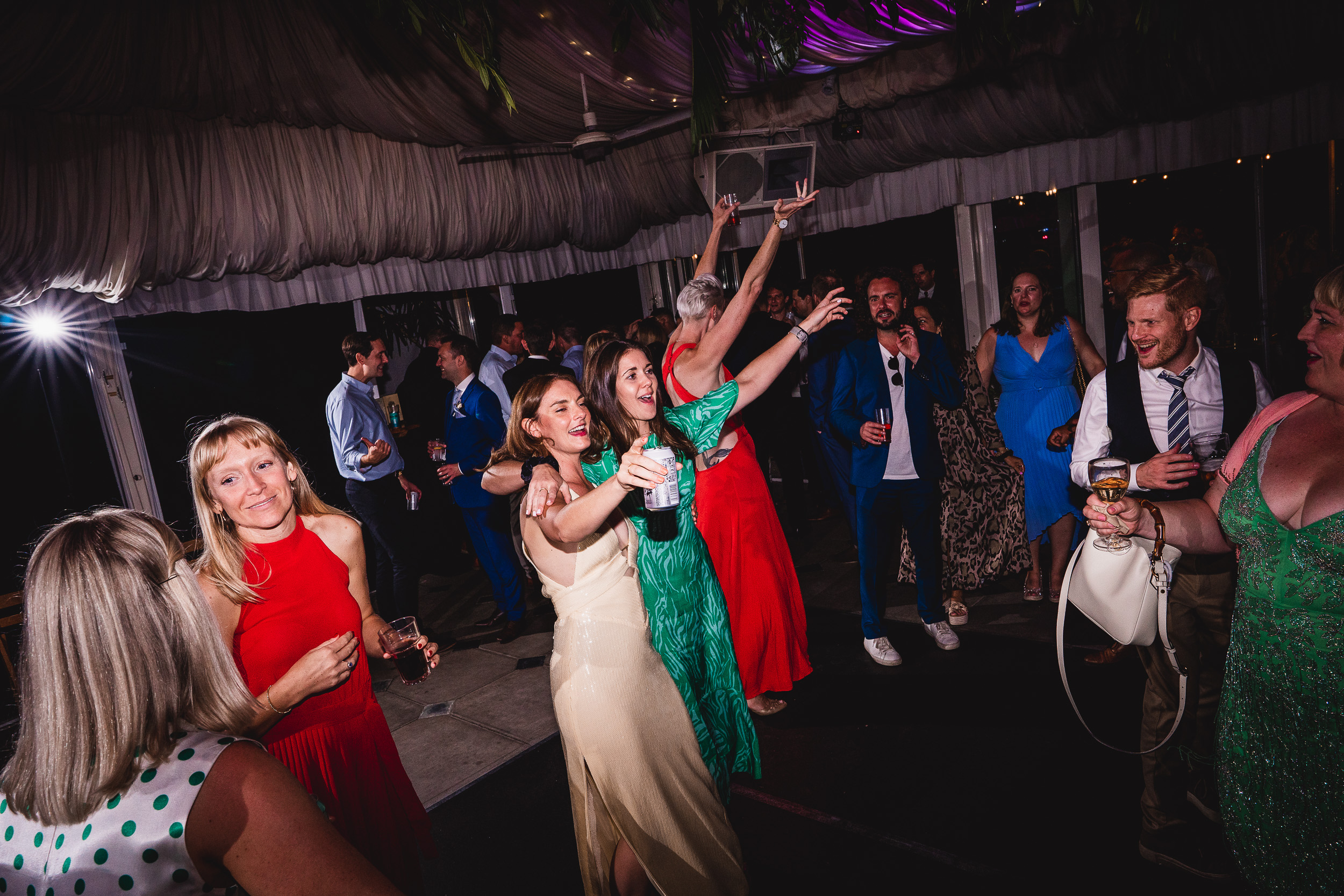 A group of people dancing at a Surrey wedding reception.