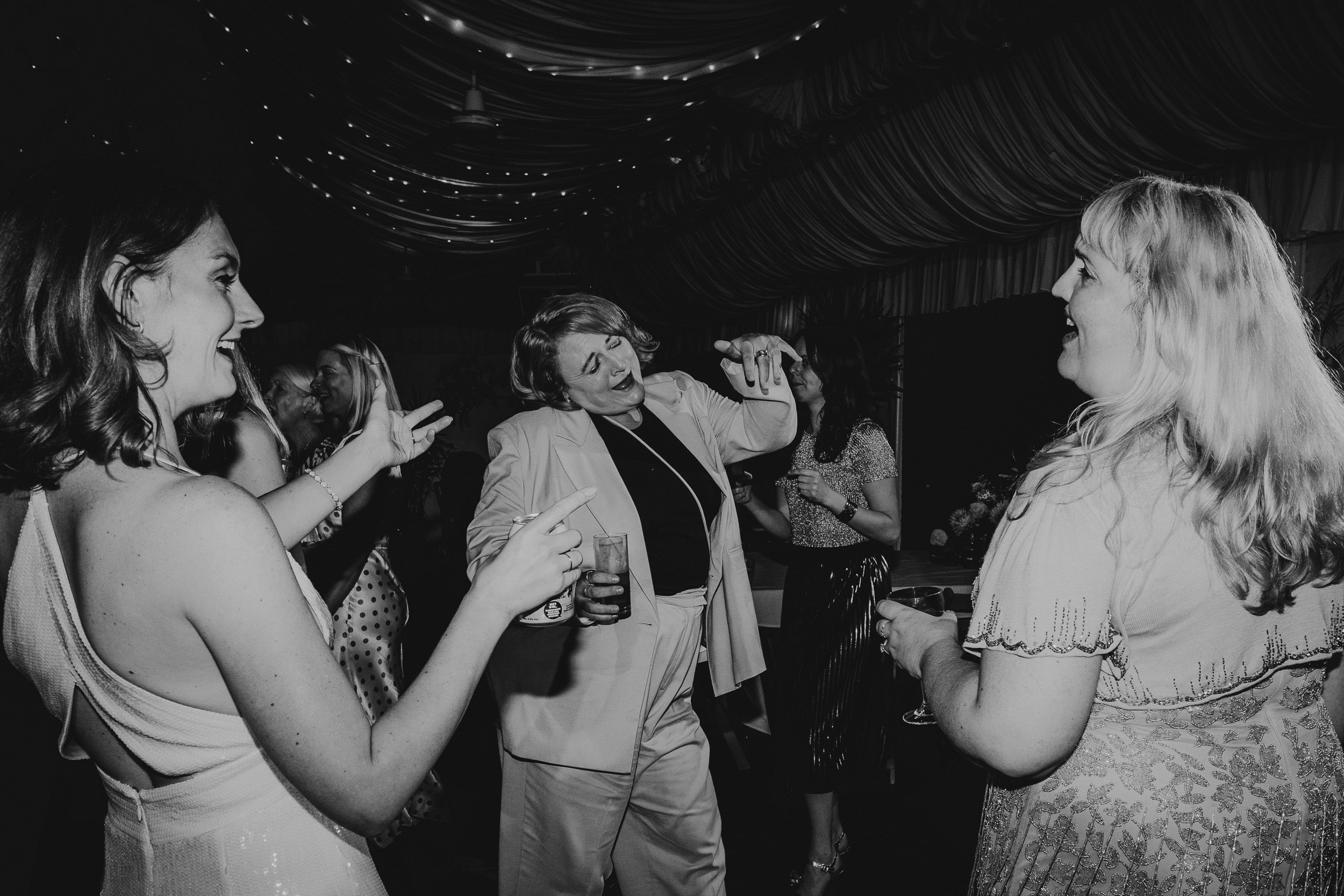 A black and white photo of people dancing at a Surrey wedding.