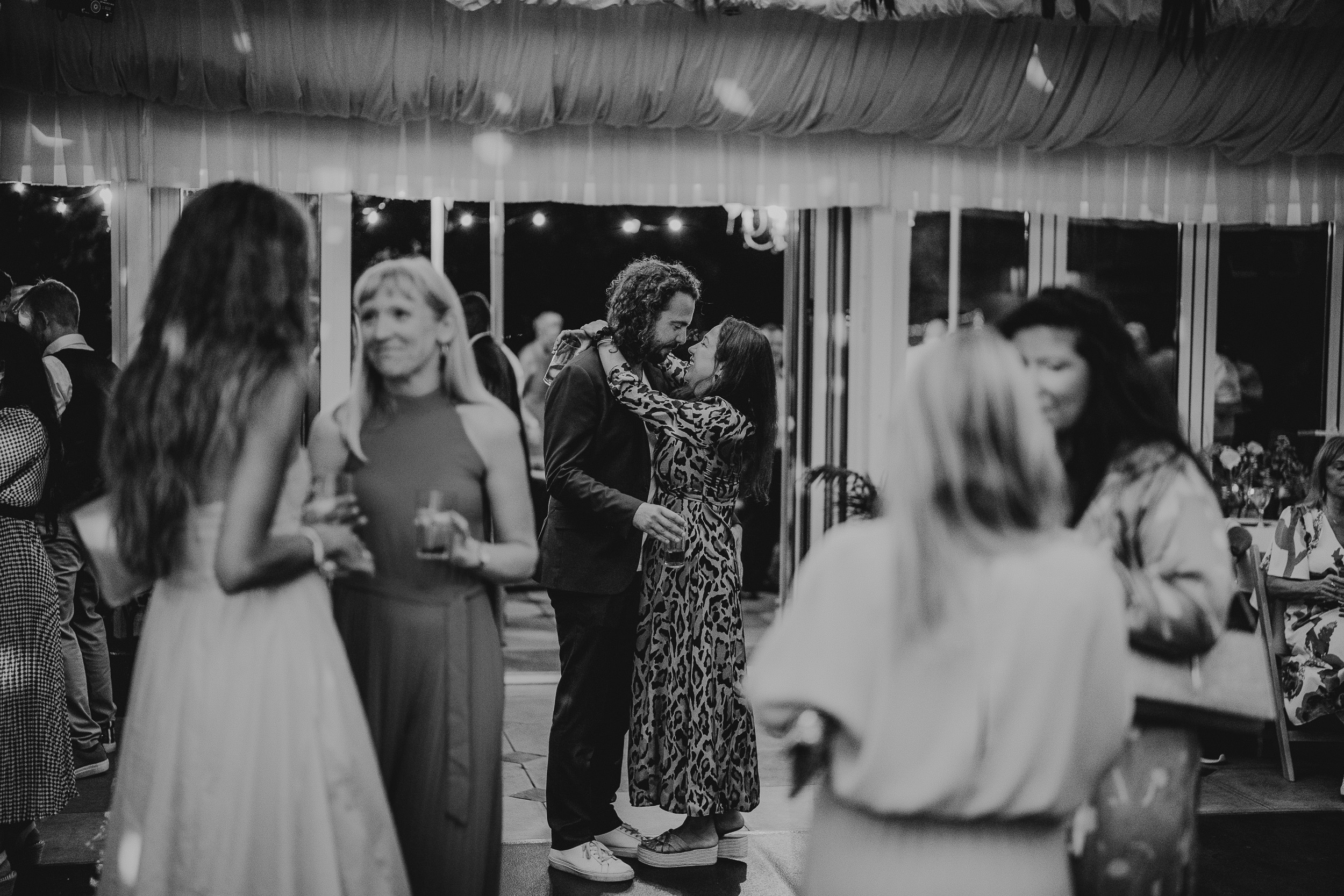 A bride and groom hugging on the dance floor at a Surrey wedding.